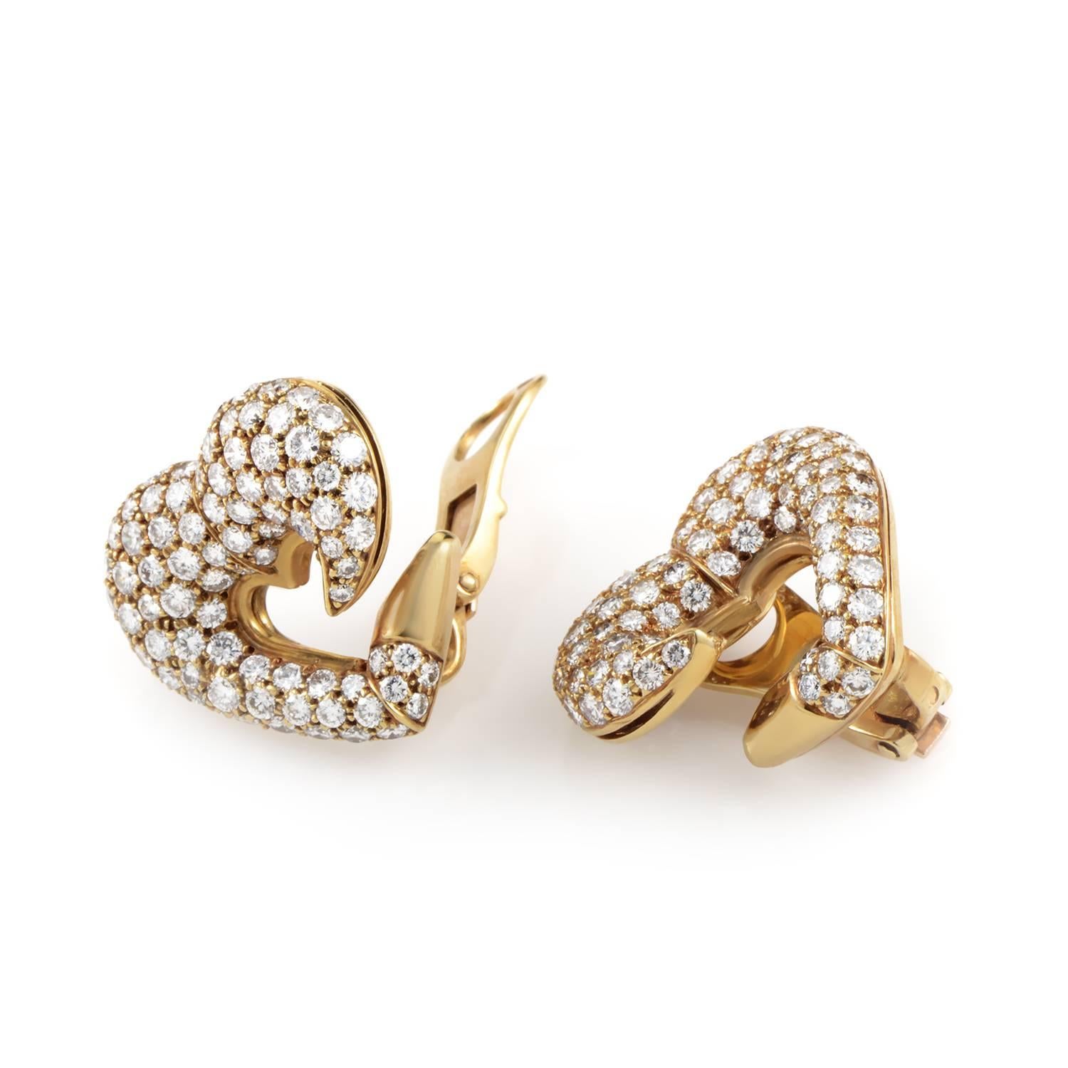 The romantic motif of a heart is complemented brilliantly in these lovely earrings from Bulgari by the dazzling combination of radiant 18K yellow gold and lustrous diamonds weighing in total approximately 5.75 carats for a fascinating