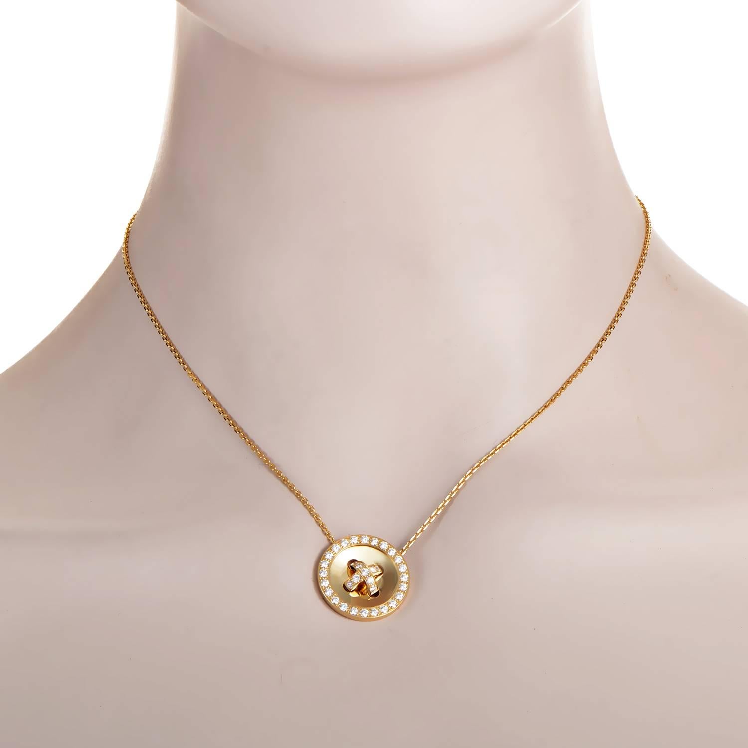 Fascinating play of light upon the scintillating diamonds weighing in total 1.10 carats and the incredibly smooth central part of the round pendant graces this delightful 18K yellow gold necklace from Van Cleef & Arpels with irresistible