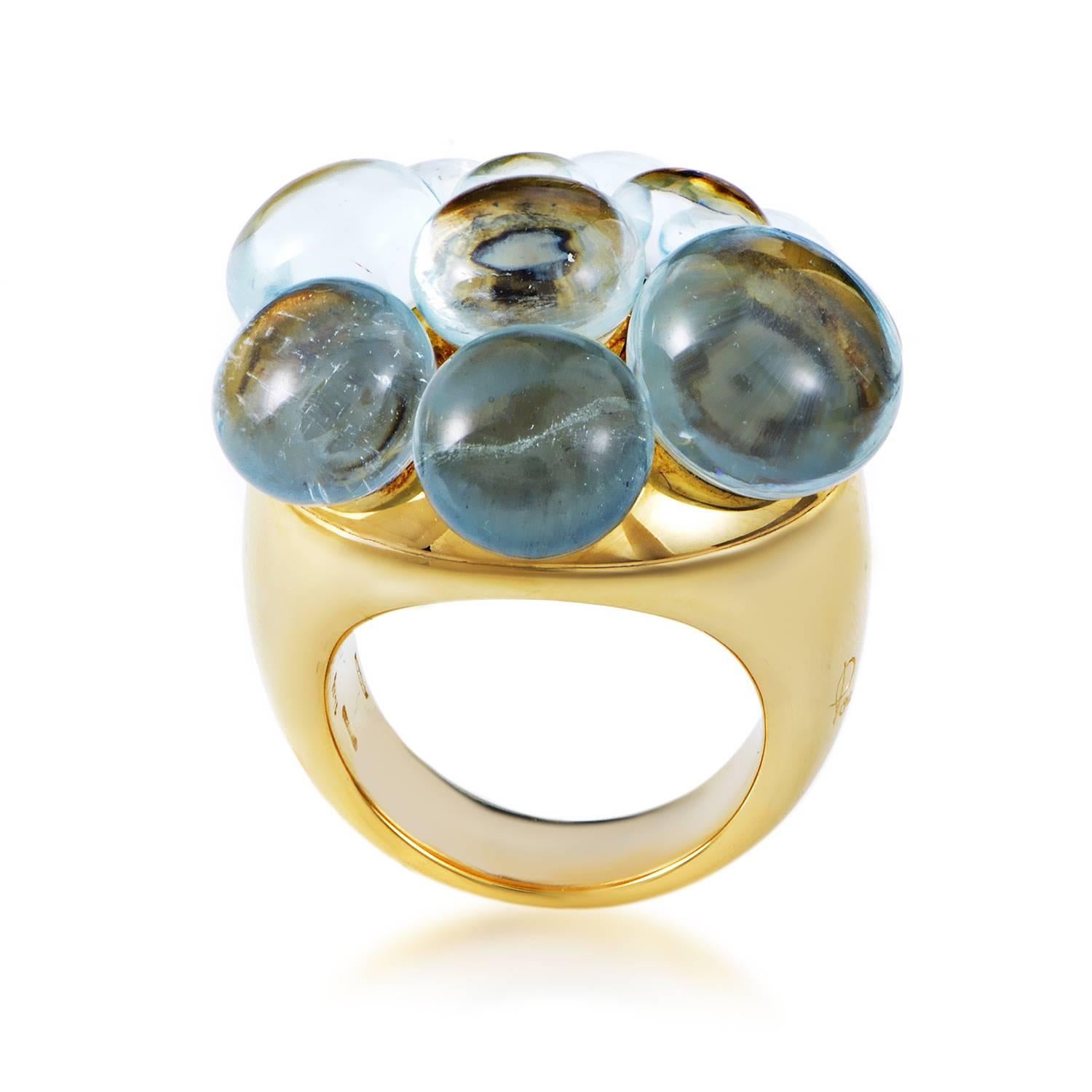 Boasting a splendid arrangement of magnificent aquamarine cabochons that contrast the charmingly warm yellow gold with their elegantly cool tone, this lovely ring from Pomellato is an item of exceptional aesthetic value.
Ring Size: 6.0 (51