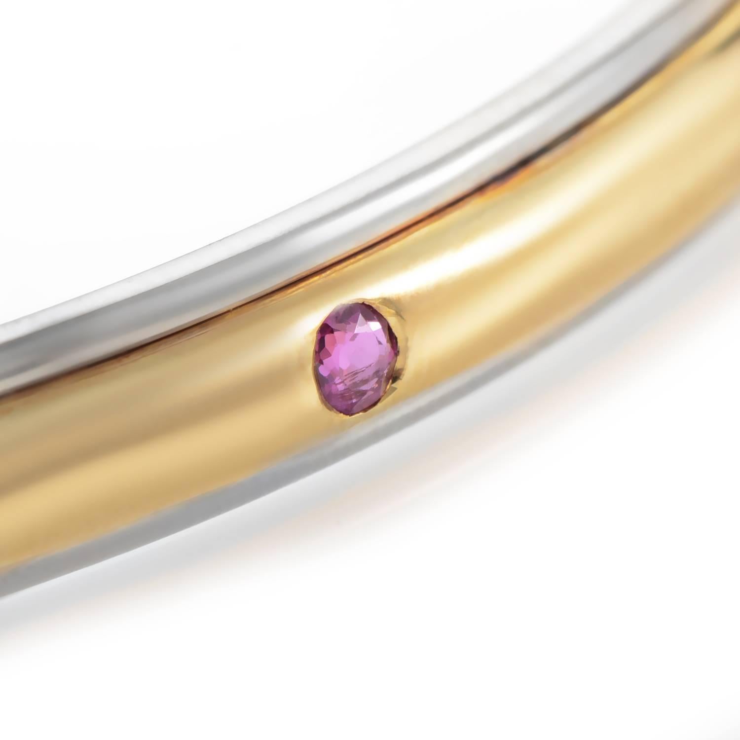 Timeless elegance and sophisticated understated luxury meet in this minimalist bracelet from Yves Saint Laurent, where fabulous 18K yellow and white gold is given a neat and slim shape, embellished with rubies, sapphires and emeralds for exceptional