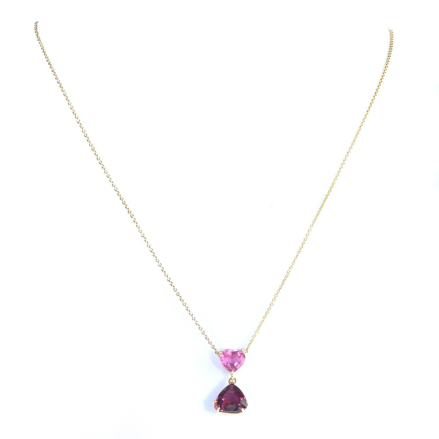 Charmingly romantic and delightfully tender, this wonderful necklace from Tiffany & Co. boasts a magnificent design by Paloma Picasso that combines 18K yellow gold with an enchanting heart-shaped tourmaline and captivating rhodolite stone.
Included