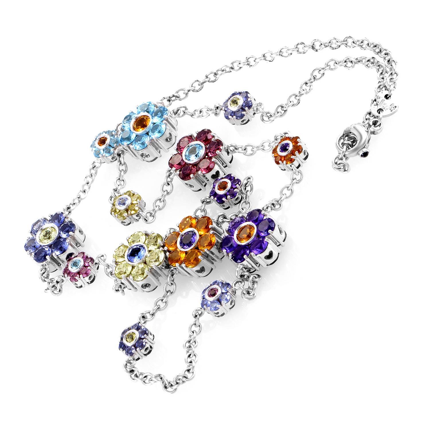 A spellbinding festival of exuberant charms blending vivid contrasting colors of lovely multi-colored semi-precious stones weighing in total 38.25 carats, this majestic 18K white gold necklace from Pasquale Bruni also features a 0.06ct sapphire on