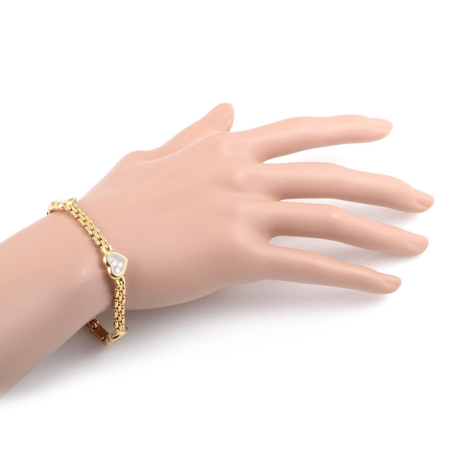 Boasting one of the brand's most recognizable and adored features, this delightful 18K yellow gold bracelet from Chopard exhibits the intriguing floating diamonds weighing in total approximately 0.60ct inside romantic heart-shaped translucent