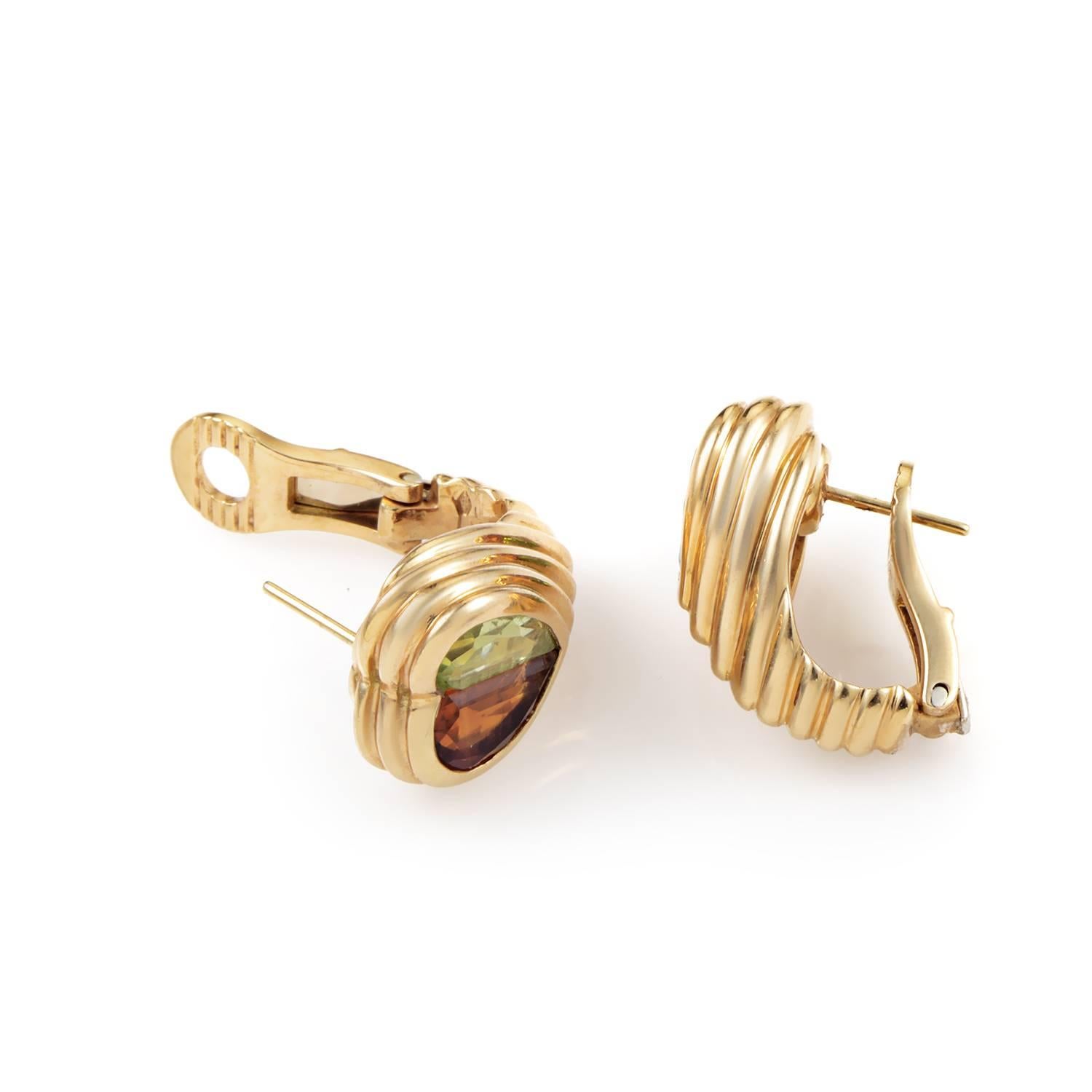With two halves of the romantic heart motif contrasted brilliantly to produce excellent balance, this enchanting pair of earrings from Bulgari made of radiant 18K yellow gold boasts the glistening orange citrine and period stones for a compelling