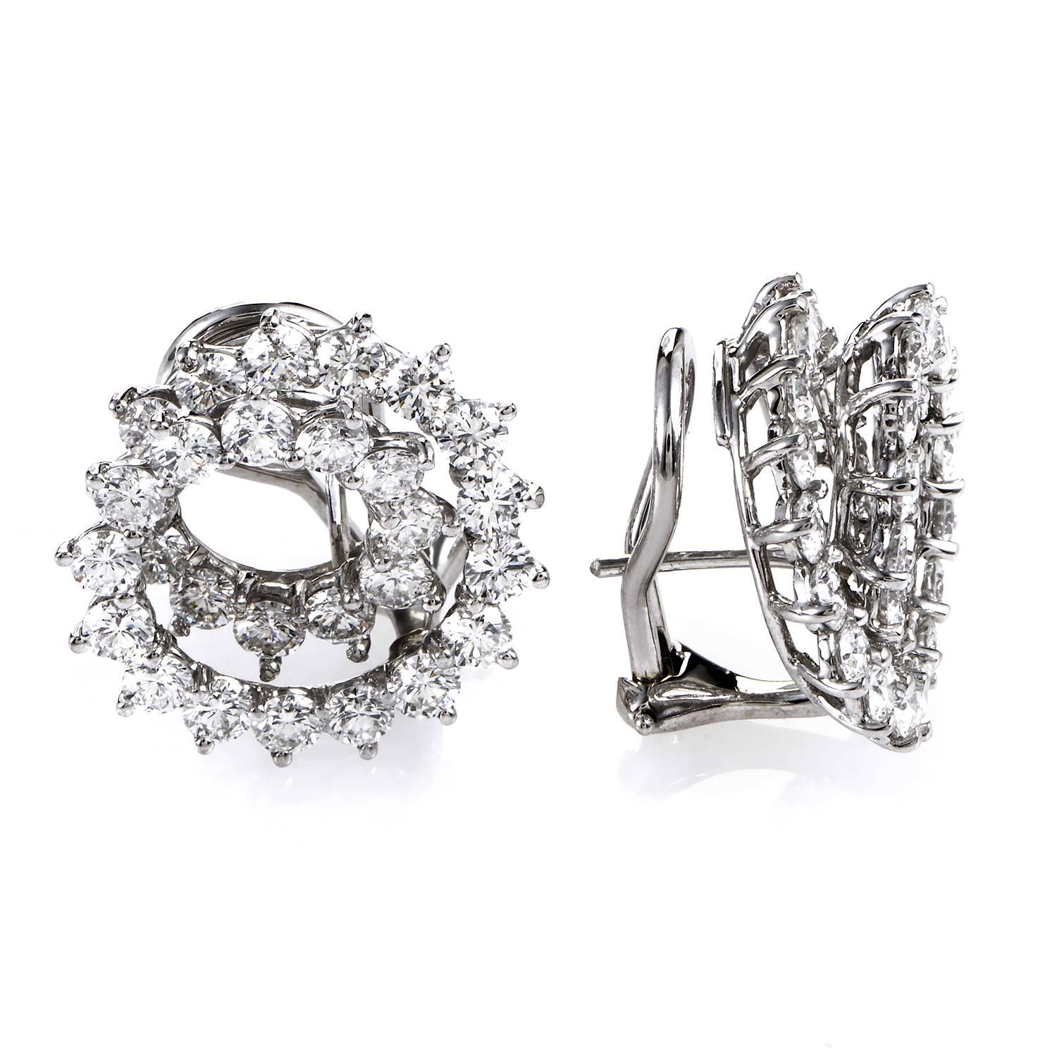 Heart-warming brilliance of spellbinding diamonds weighing in total approximately 3.30 carats embellishes the intriguingly spiraling platinum body for majestic allure in these extraordinary earrings designed by Angela Cummings for Tiffany &