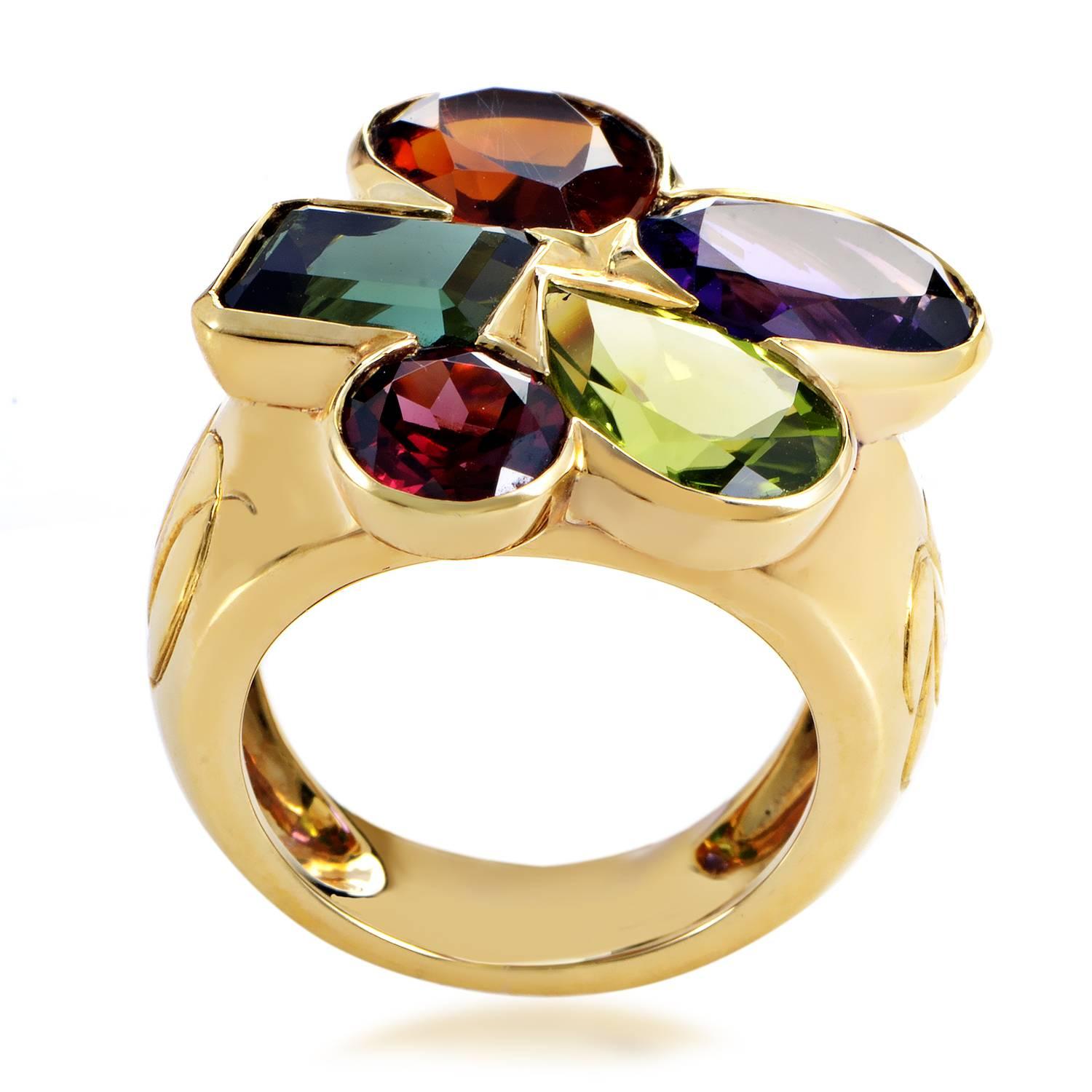 An exuberant and vivacious festival of vivid colors is brilliantly arranged upon this extraordinary ring from Dior, with preciously gleaming 18K yellow gold providing the perfect backdrop for the delightfully nuanced sparkle of eye-catching