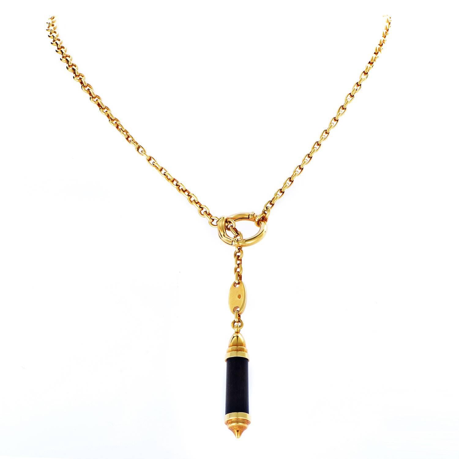 Producing eye-catching allure through striking contrast provided by captivating dark ebony wood against the warm, romantic tone of 18K yellow gold, this gorgeous necklace from Chaumet combines aesthetic qualities of these materials in wonderful