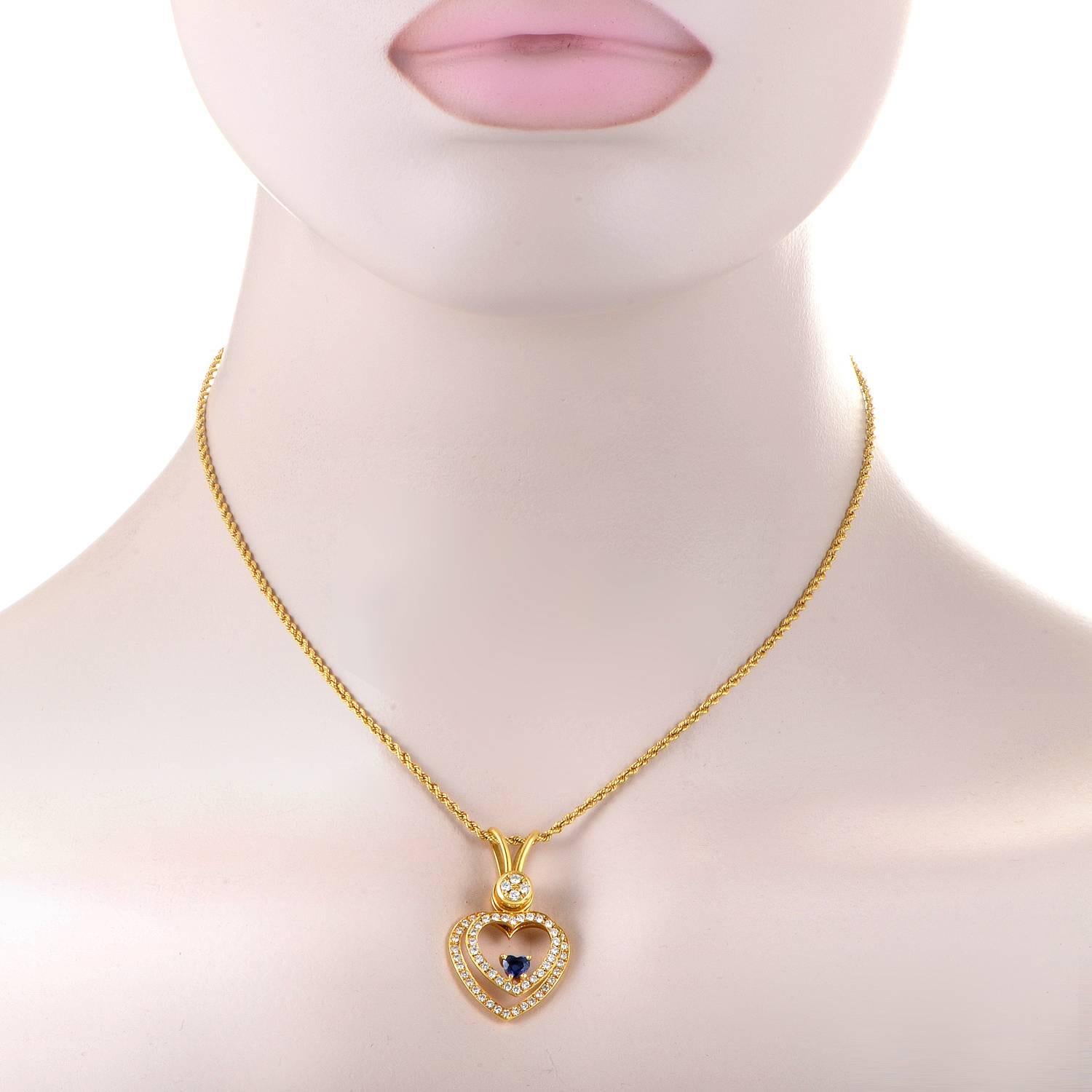 Producing an irresistible romantic allure through the meaningful symbol of a heart in the design of the pendant as well as the glamorous blend of 18K yellow gold and glittering diamonds totaling approximately 1.00 carats, this spellbinding necklace