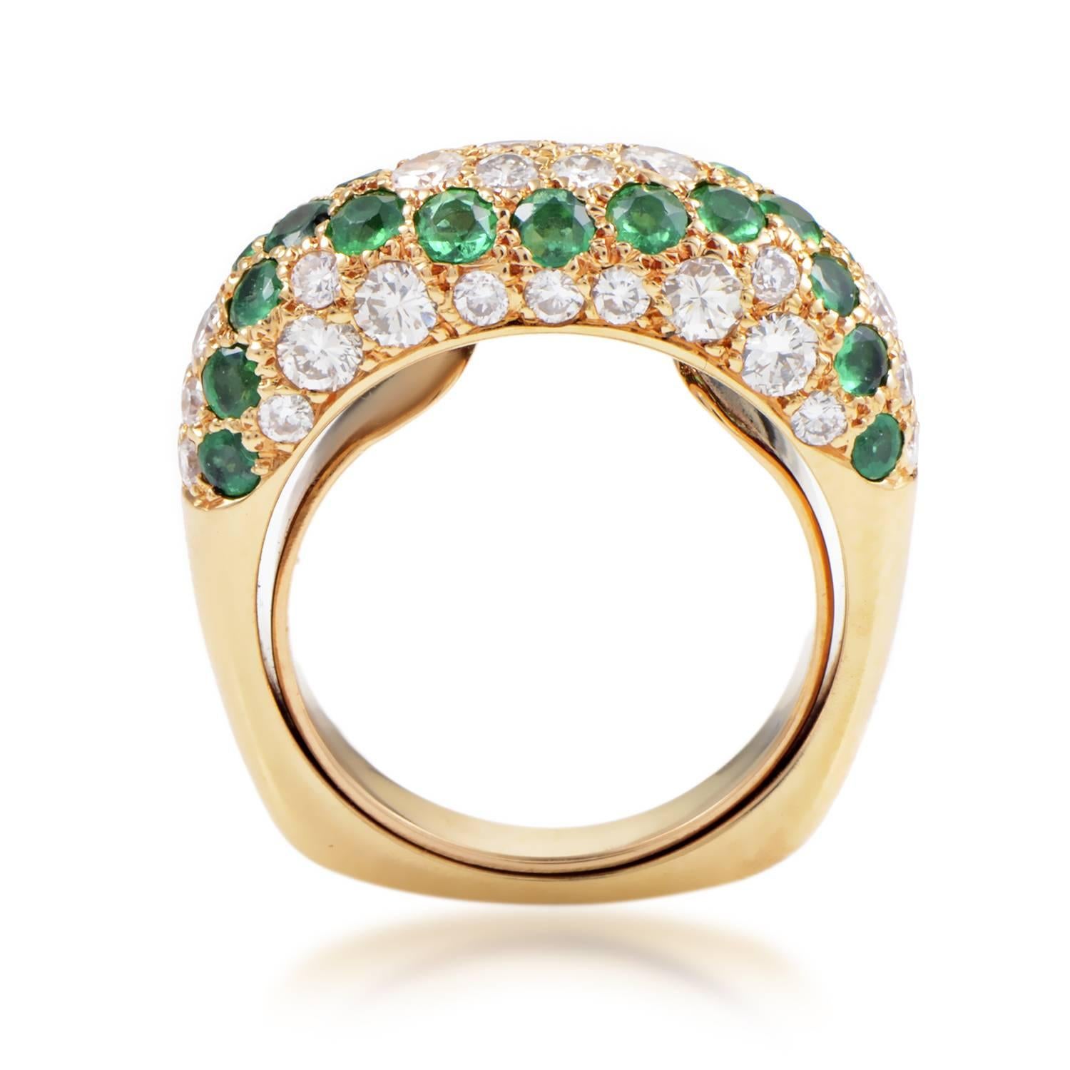 The intrinsic elegance of splendid emeralds weighing in total 1.20 carats and brilliant luster of diamonds totaling 0.75ct blend perfectly upon delightful 18K yellow gold in this stunning ring from Boucheron. 
Ring Size: 4.5 (47 3/4)
Band