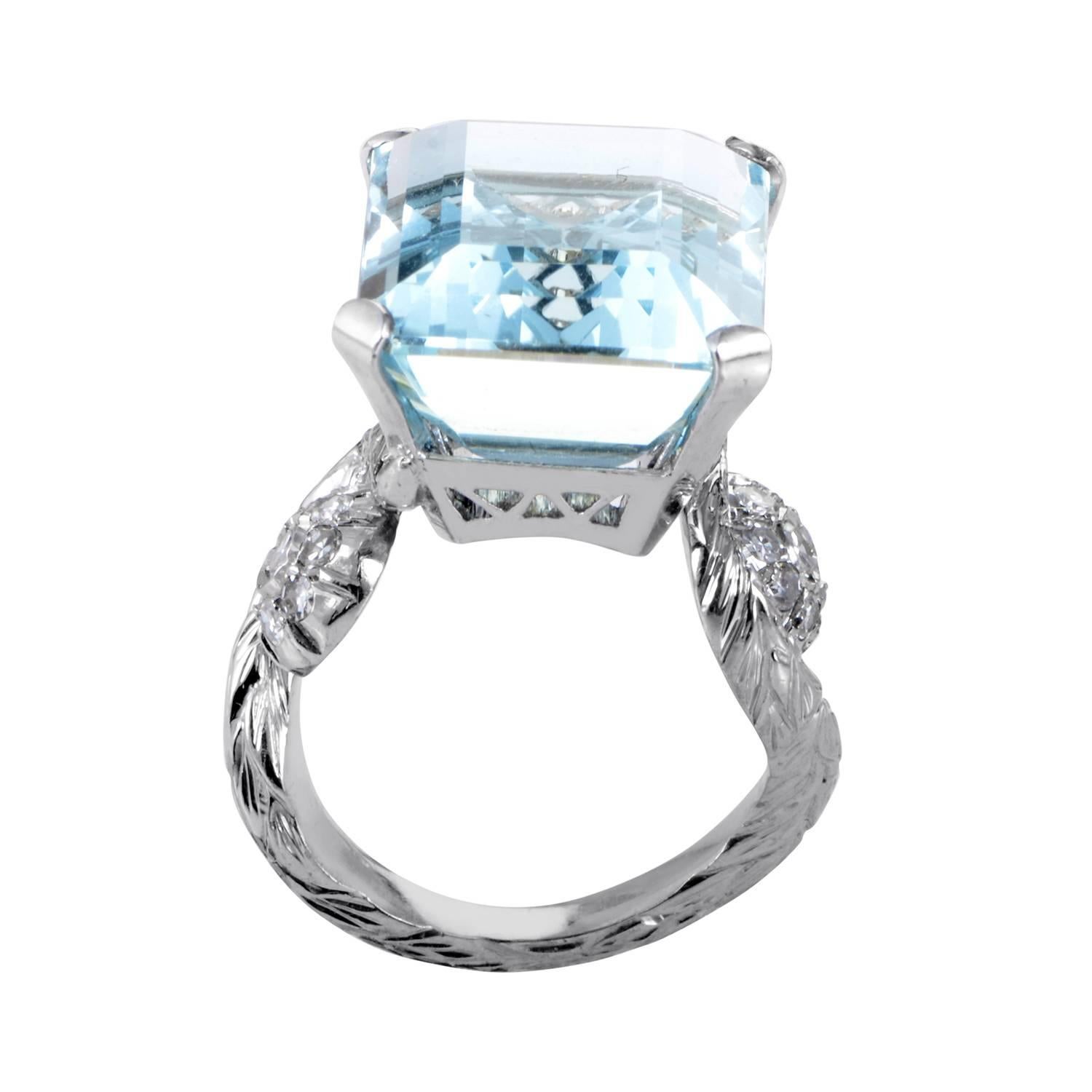 The watery glisten, captivating depth and wonderfully bright nuance of the splendid aquamarine stone weighing 18.45 carats are harmoniously complemented by the unblemished shimmer of 18K white gold and lustrous allure of diamonds totaling 0.52ct in