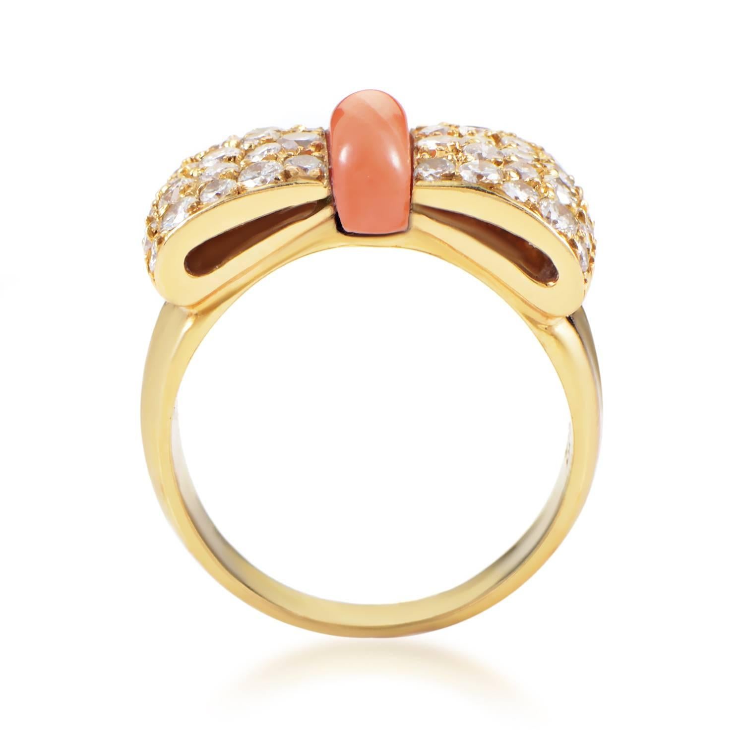 The compelling shape of a bow tie graces the top of this spellbinding ring from van Cleef & Arpels, with enchanting 18K yellow gold adorned with glittering diamonds weighing in total 1.00 carat and complemented by a neat coral stone.
Ring Size: 5.5