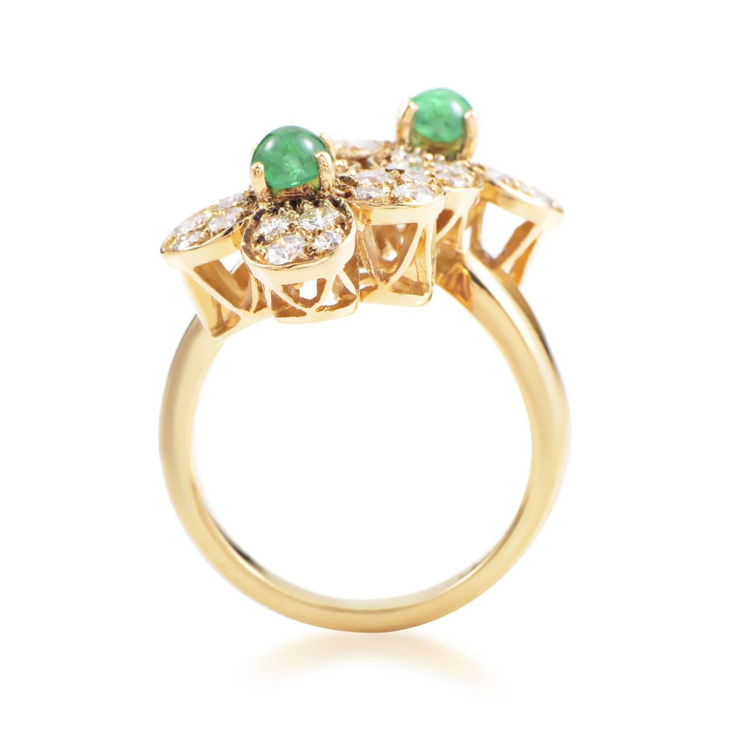This lovely ring from Van Cleef & Arpels' Trefle collection is the perfect adornment for any situation. The ring is made of 18K yellow gold and boasts two flower motifs paved with .64ct of white diamonds. Lastly, .47ct of emeralds finish off this