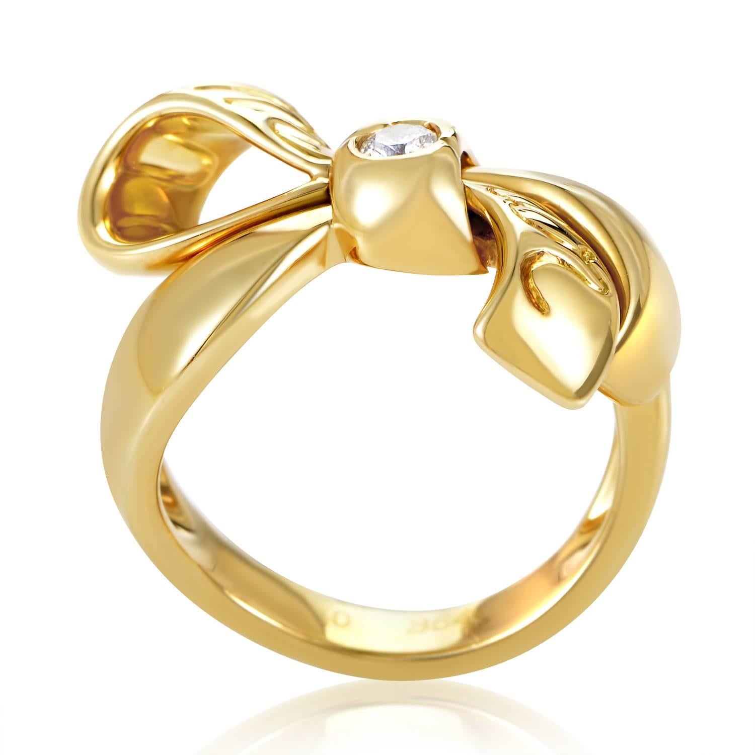 The adorable design of this dainty golden ring from Dior is sure to please. Forged from 18K yellow gold into the design of a delicate bow, the ring's only adornment is a single .10ct diamond.
Ring Size: 6.25
Ring Top Dimensions: 20 x 7mm
Band