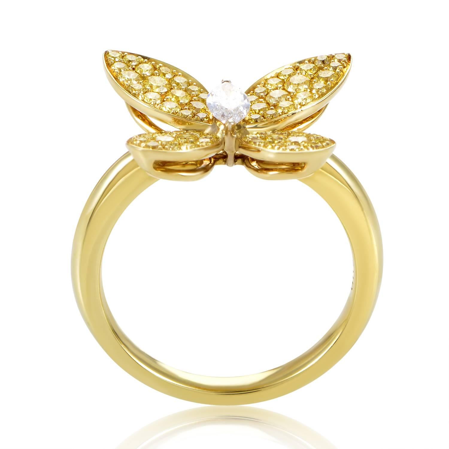 A rare and luxurious jewel, this ring from Graff Diamonds is an absolute delight! The ring is made of 18K yellow gold and boasts a spectacular butterfly motif comprised of a .25ct marquise-cut white diamond body and 1ct of fancy vivid yellow diamond