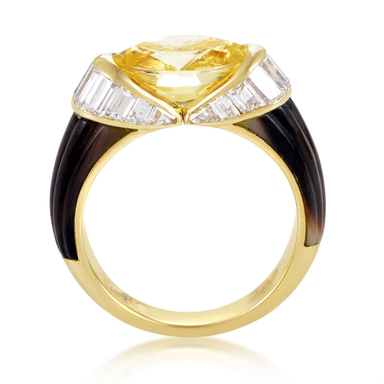 This gorgeous ring from Piaget is without comparison! The ring is made of 18K yellow gold and boasts shanks accented with mother of pearl. Lastly, a 1.25ct diamond baguette 