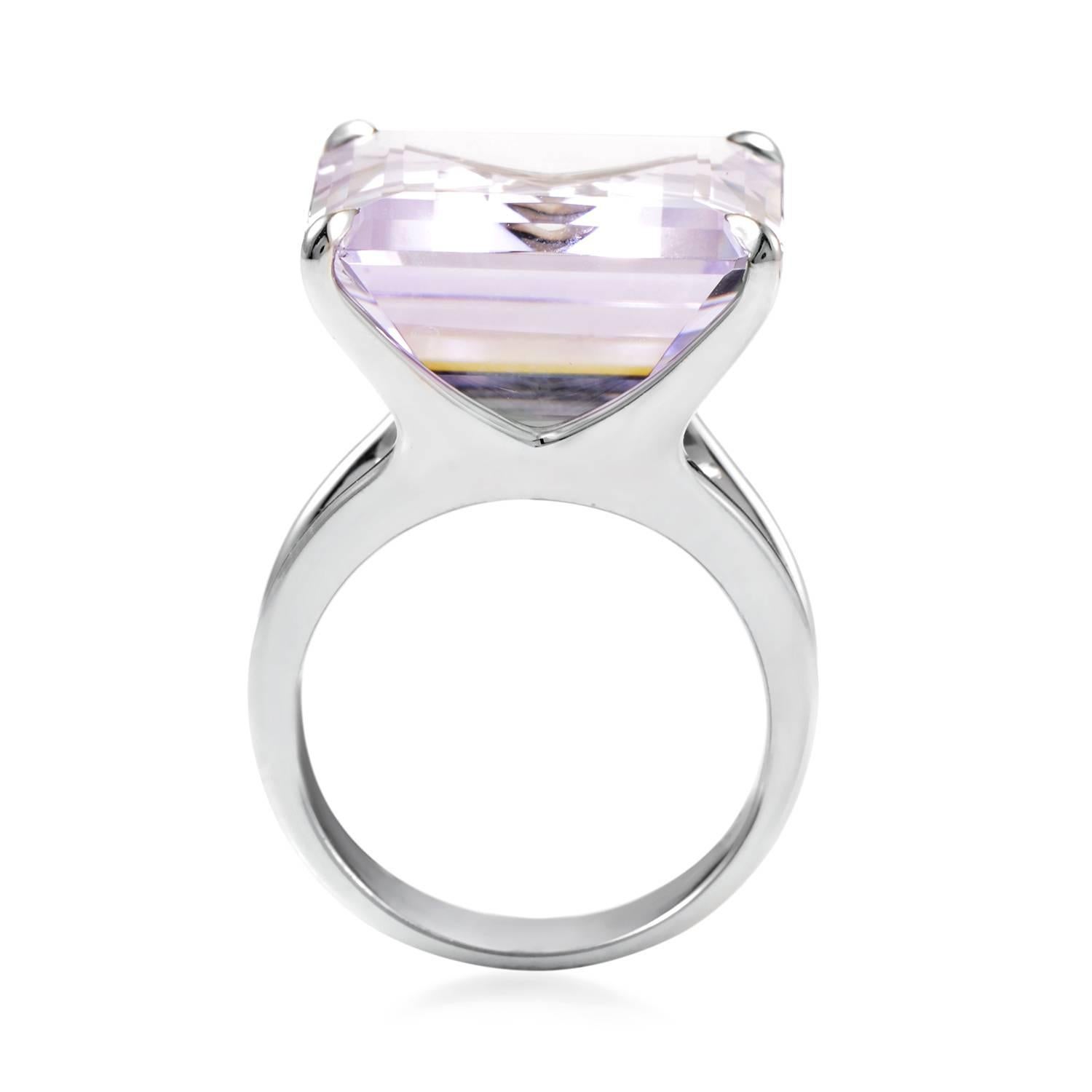 Eye-catching with its bright tone and captivating with its fascinating glistening depth, the wonderfully shaped amethyst tastefully complements the elegant 18K white gold body of this outstanding ring from H.Stern, while a delicate diamond is placed