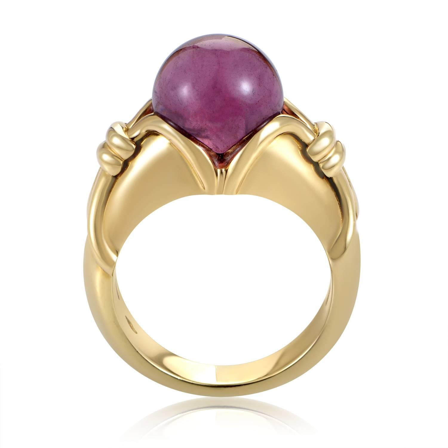 Upon a fabulously ornamented body made of unblemished 18K yellow gold, a magnificent pink tourmaline exudes its delightful nuance to perfectly complement the allure of gold radiating from beneath, creating a memorable sight in this outstanding ring