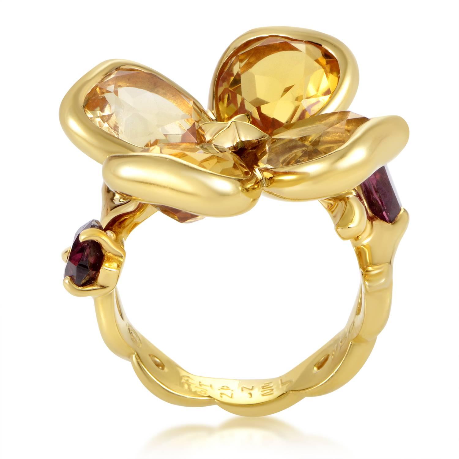 Taking the charming motif of a flower to a whole another level with a brilliantly tasteful combination of gleaming 18K yellow gold and glistening gems, this spellbinding ring from Chanel is adorned with stunning rhodolite garnets and adorable