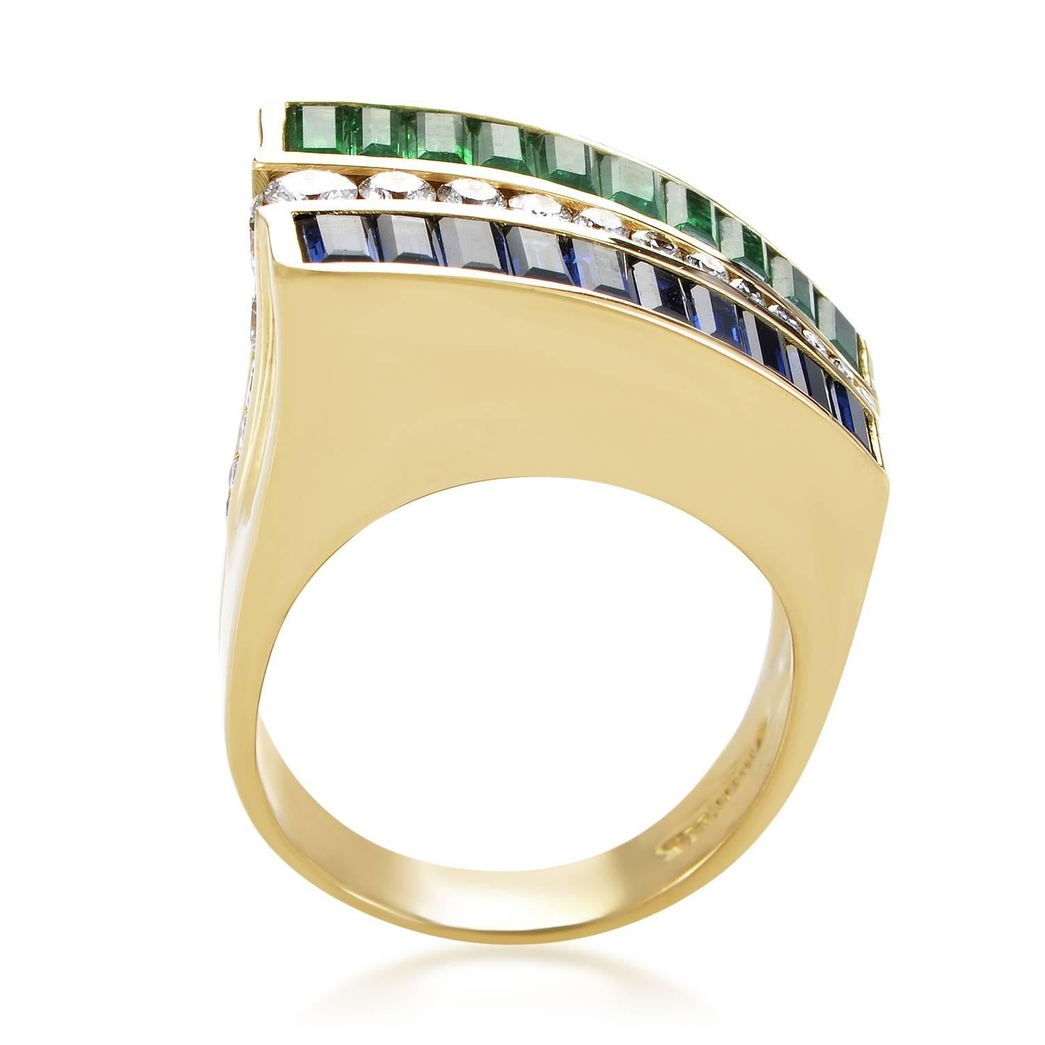 With brilliant diamonds totaling 0.65ct lined neatly to separate and emphasize the alluring gems on the sides, this exquisite ring from Charles Krypell complements luxurious 18K yellow gold with emeralds weighing in total 1.70 carats and sapphires