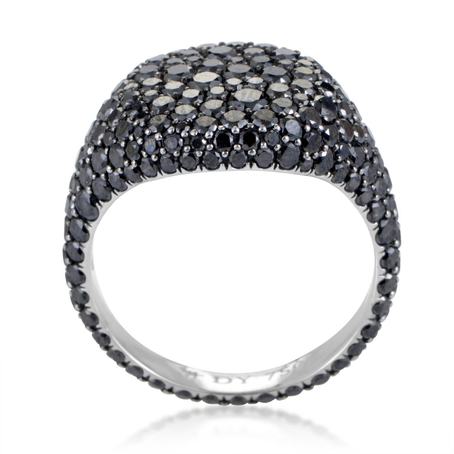Employing the captivating beauty of magnificent black diamonds weighing in total 2.73 carats and allowing them to exude their full appeal through a brilliant arrangement, this outstanding 18K white gold ring from David Yurman presents an astonishing