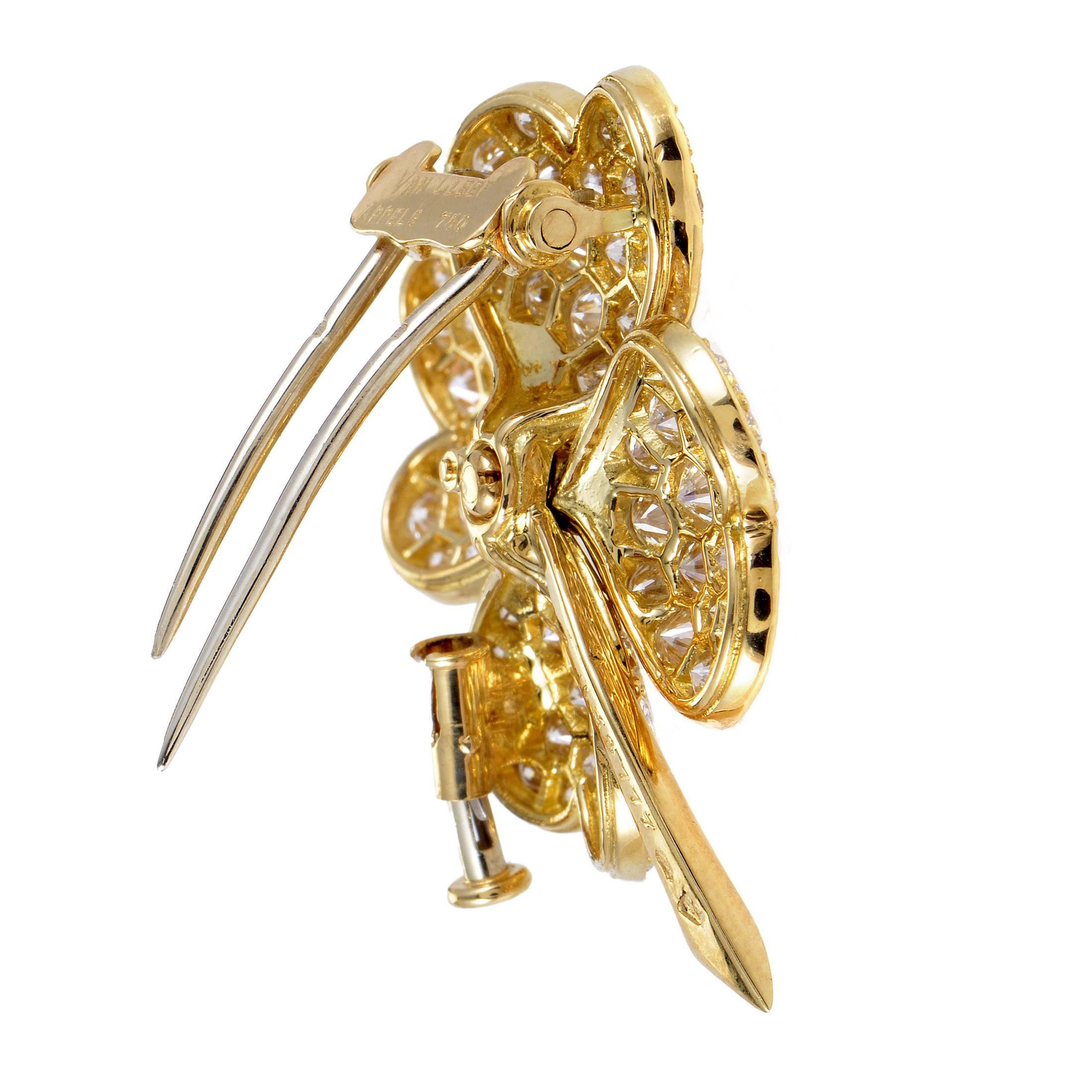 A truly breath-taking interpretation of an adorable symbol believed to bring good luck to the wearer, this scintillating four-leaf clover brooch from the Cosmos collection by Van Cleef & Arpels is made of radiant 18K yellow gold with a stunning