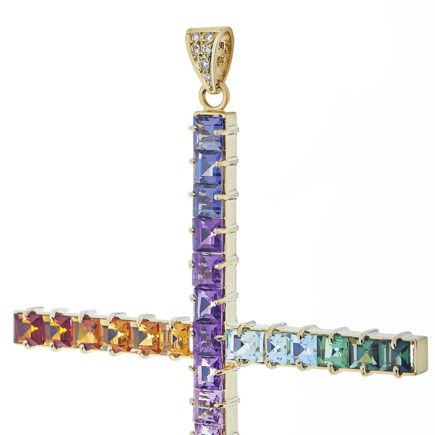 Wonderfully gradated nuances of marvelous multicolored gems create a delightfully balanced appearance in this vivacious 14K yellow gold cross-shaped pendant which boasts a fabulous blend of glistening diamonds, amethysts and tourmalines as well as