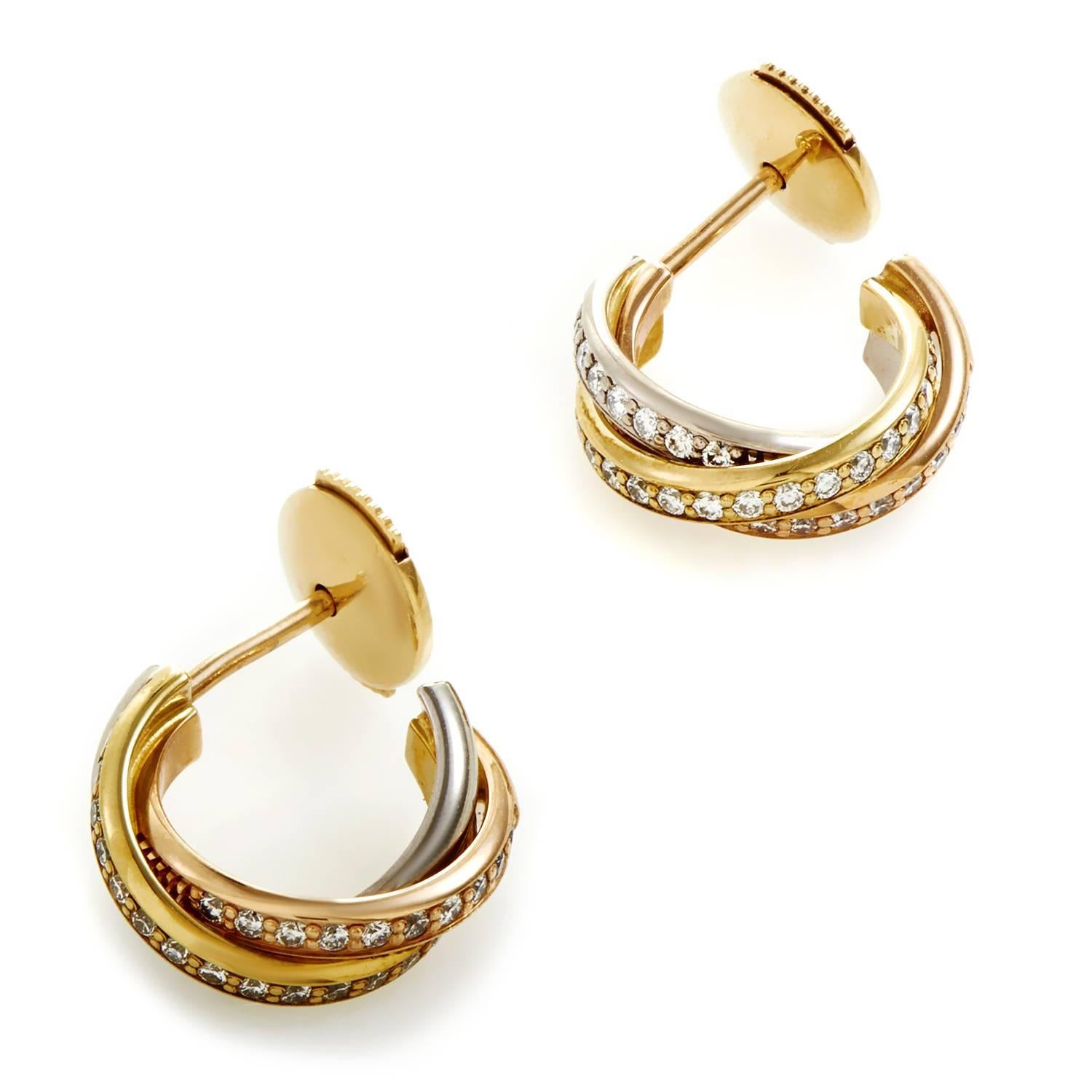 In keeping with the historic legacy of the iconic Trinity design introduced by the brand in the first half of the 20th century, these delightfully feminine earrings from Cartier boast a tasteful blend of 18K yellow, white and rose gold embellished