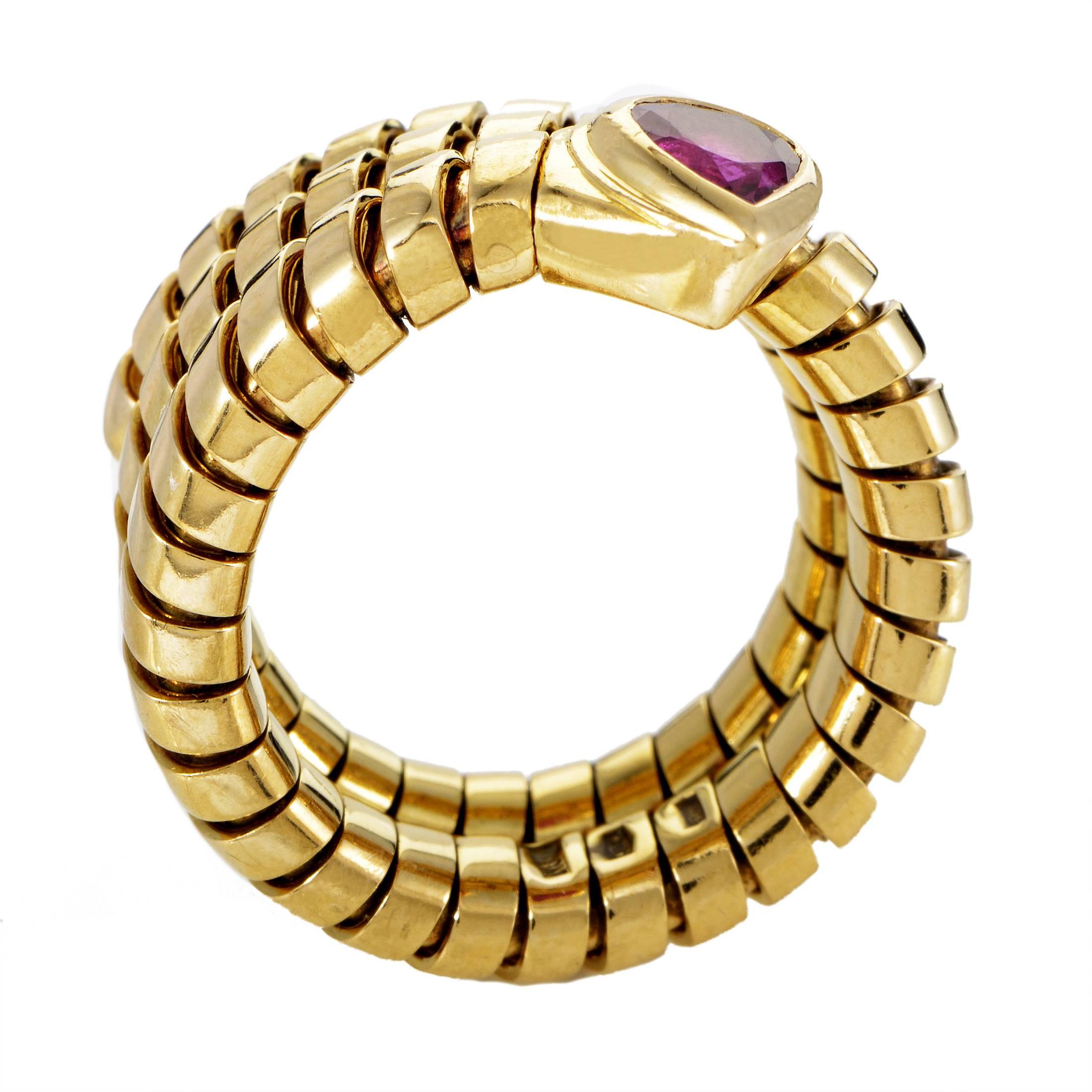 Coiled around your finger like a tiny serpent made of prestigious 18K yellow gold, this enchanting ring from Bulgari boasts a romantic heart-shaped ruby as a central point and gorgeous culmination of a brilliant design.
Ring Size: 5 (49), 75
Ring