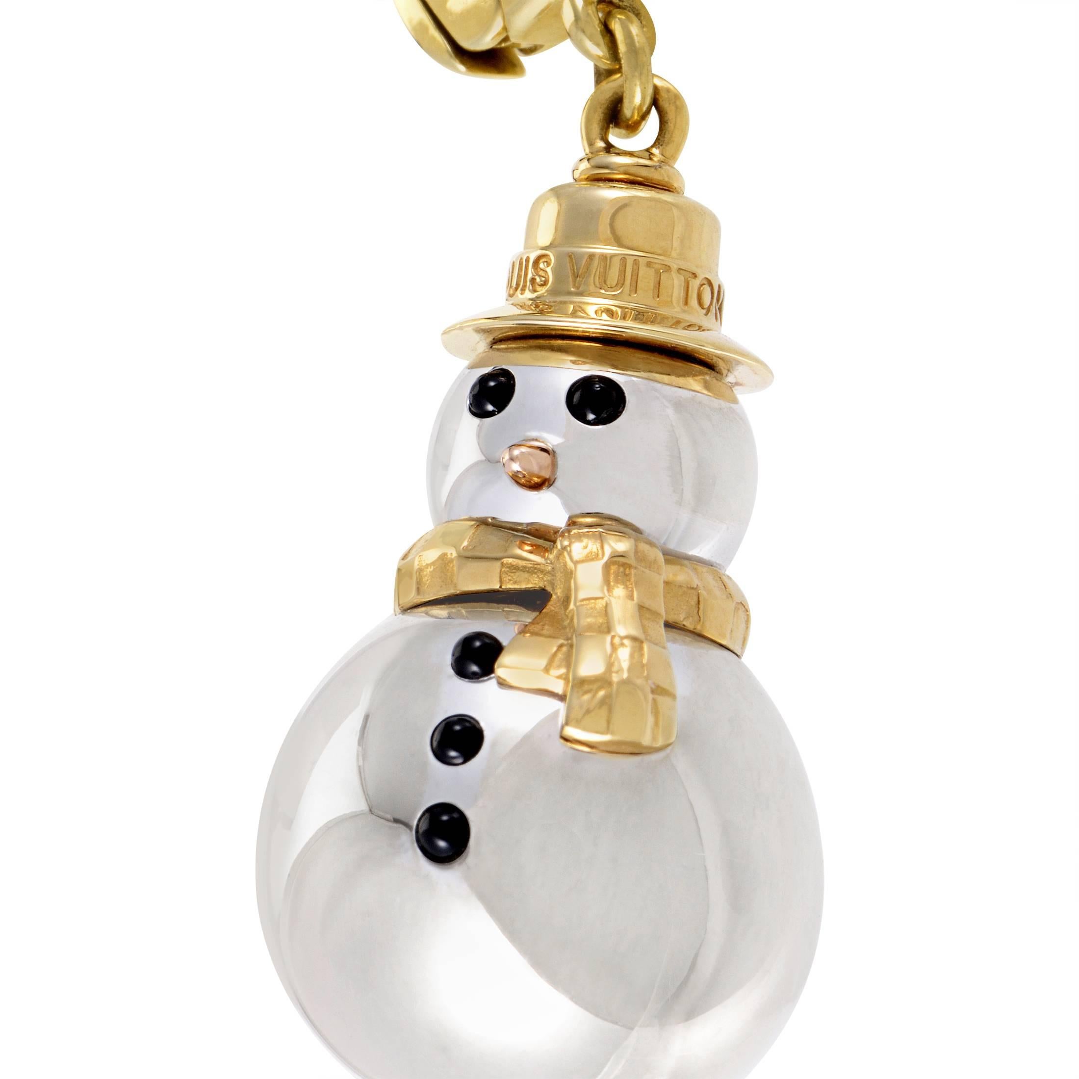 Brilliantly combining precious materials to realistically depict the compelling image of a snowman, Louis Vuitton created this fascinating pendant made of 18K white and yellow gold with stunning onyx stones perfectly completing the design.
Included