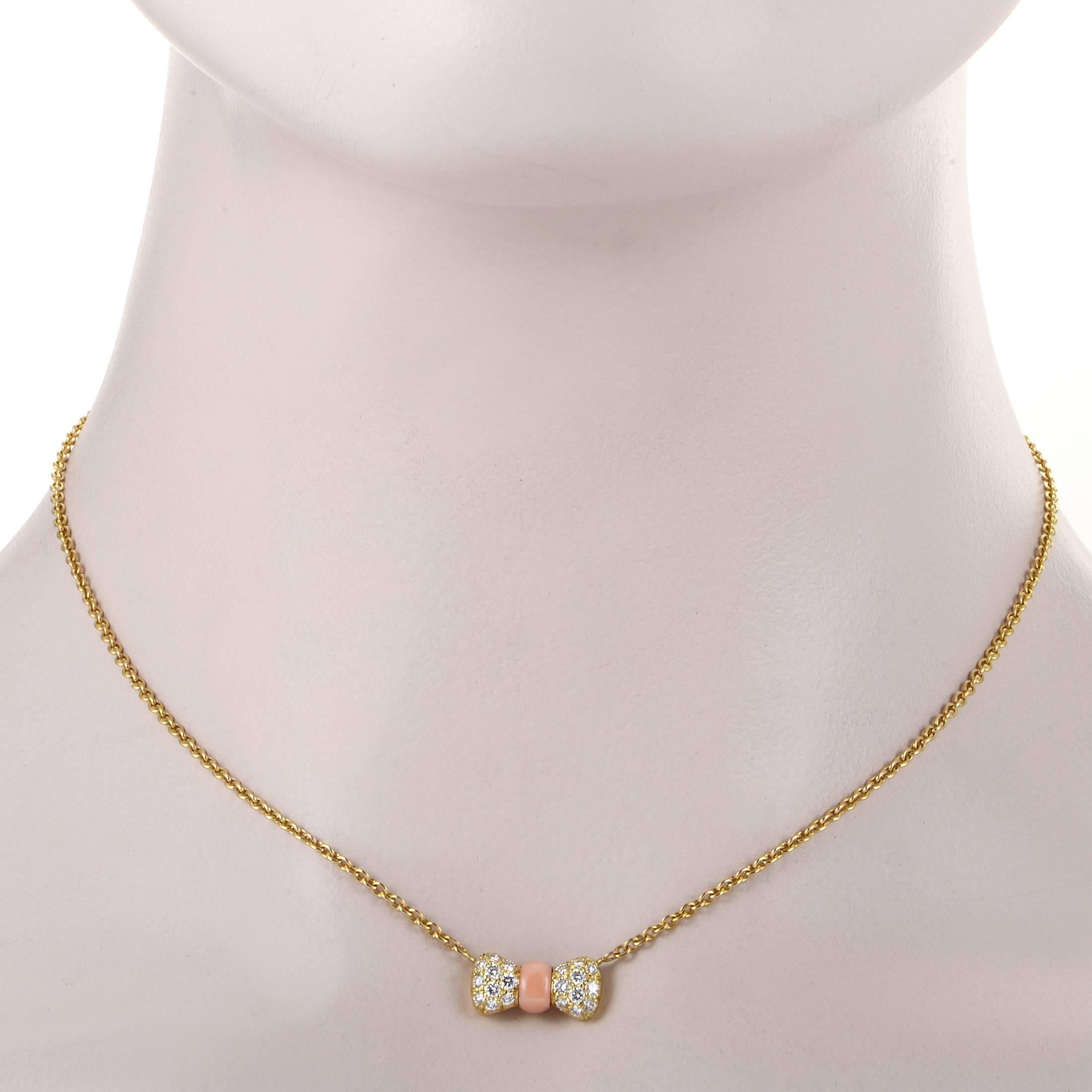 A sumptuous interpretation of the nifty bow tie motif, the pendant of this enchanting 18K yellow gold necklace from Van Cleef & Arpels combines the wonderful appeal of the pastel coral stone and dazzling allure of diamonds totaling 0.39ct to create