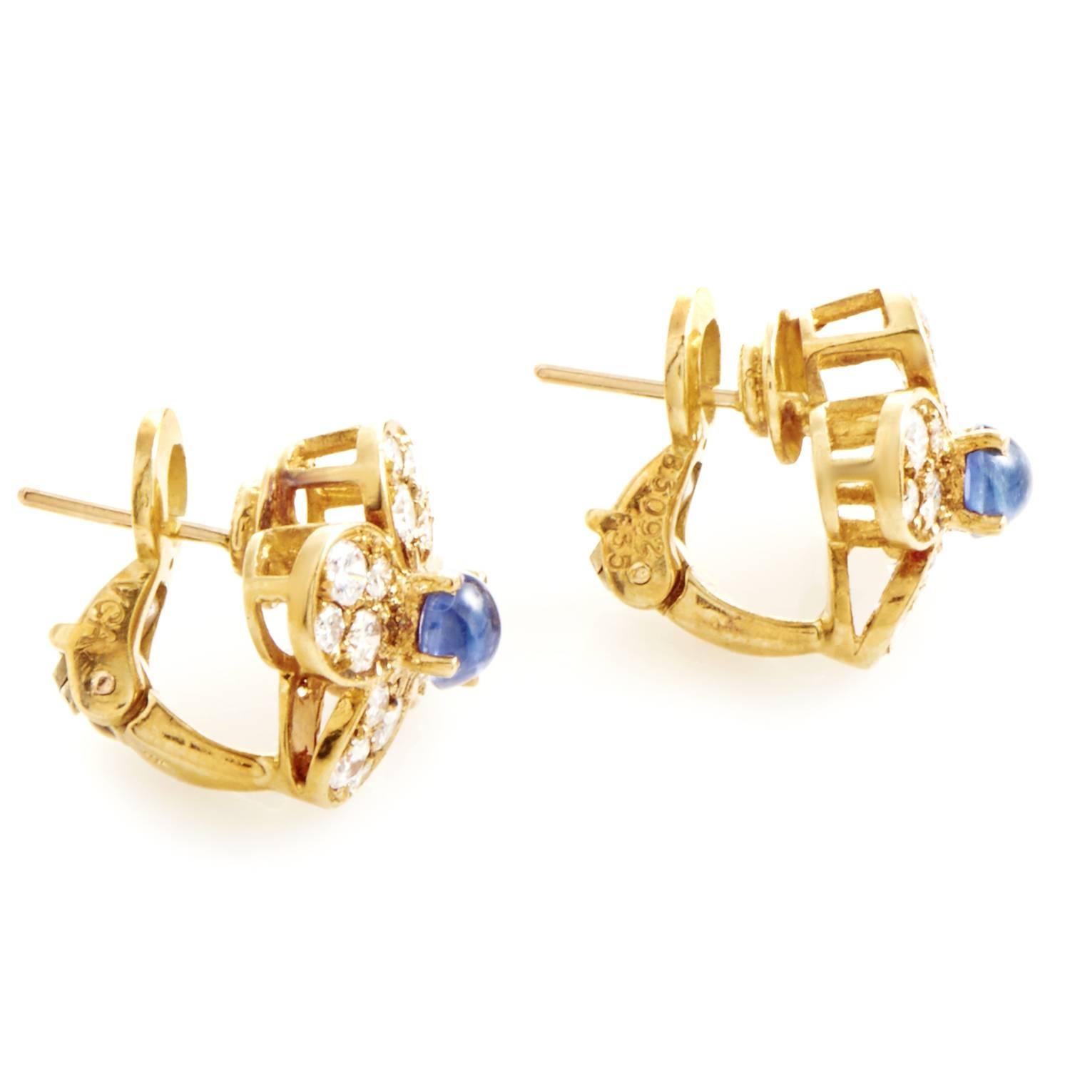Spellbinding floral décor is created by combining the fabulous radiance of 18K yellow gold, charming brilliance of diamonds totaling 1.25 carats and splendid color of the magnificent sapphires amounting to 0.60ct in these enchanting earrings from