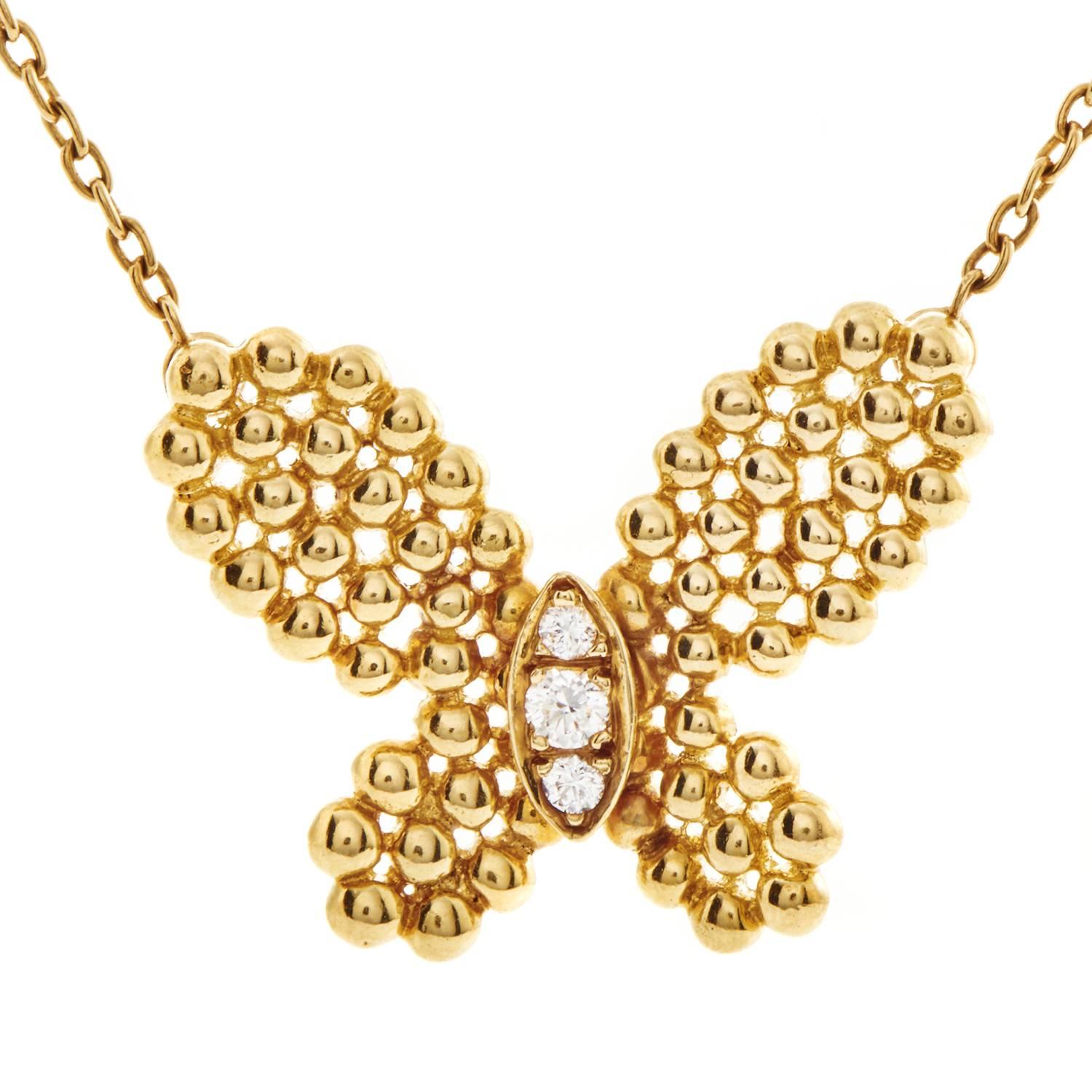 A compelling interpretation of the delightful butterfly motif, the pendant of this spellbinding necklace from Van Cleef & Arpels is comprised of shimmering beads of 18K yellow gold while set with glistening diamonds totaling 0.12ct for a delicate