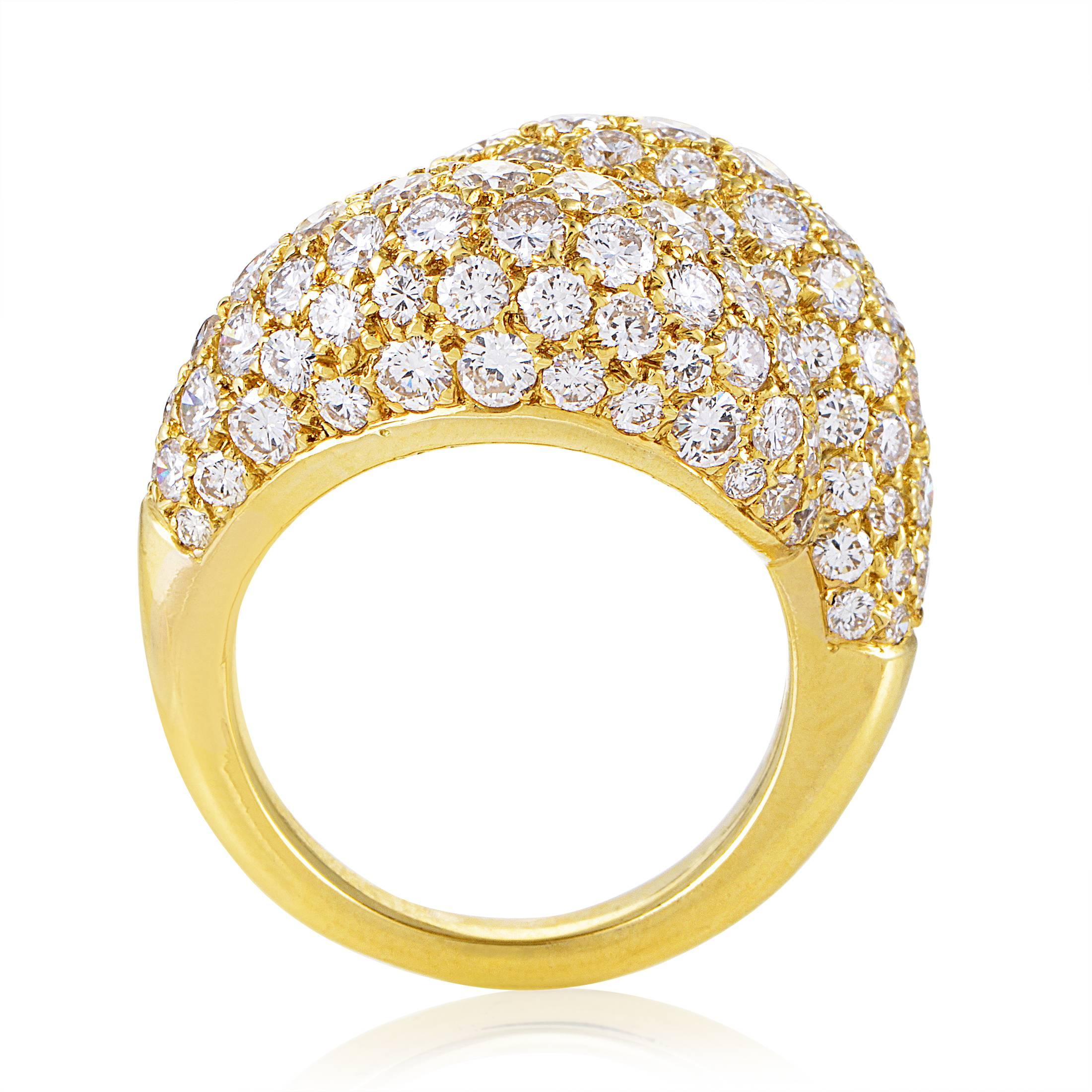 A sight of sheer glamour and flamboyant prestige that relies on excellence and taste, this astonishing 18K yellow gold ring from Van Cleef & Arpels boasts a mesmerizing arrangement of glistening F-color diamonds of VVS clarity weighing in total