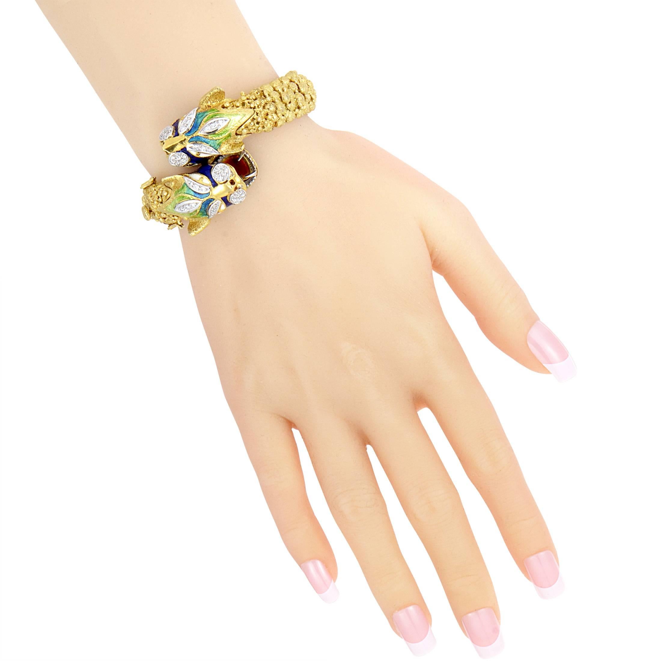 Fiercely fabulous, this bangle bracelet is without comparison. The bracelet is made primarily of 18K yellow gold and is accented with white gold and brightly colored enamels. Lastly, .50ct of diamonds add a gorgeous hint of sparkle to the overall