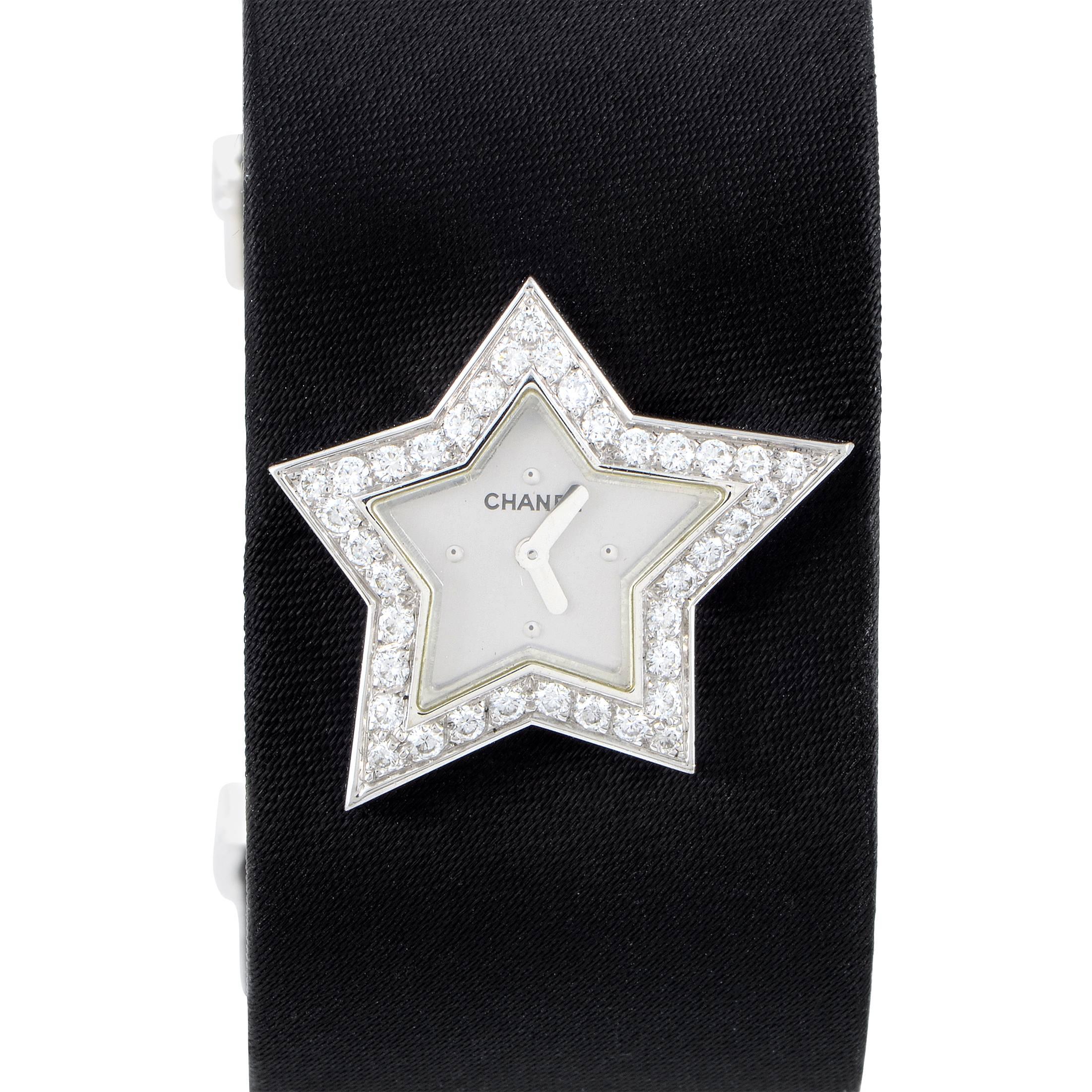 Boasting the brand's highly renowned shape of a comet seemingly immersed into the captivating darkness of the strap, the case of this gorgeous timepiece from Chanel is made of 18K white gold and adorned with lustrous diamonds upon the bezel to