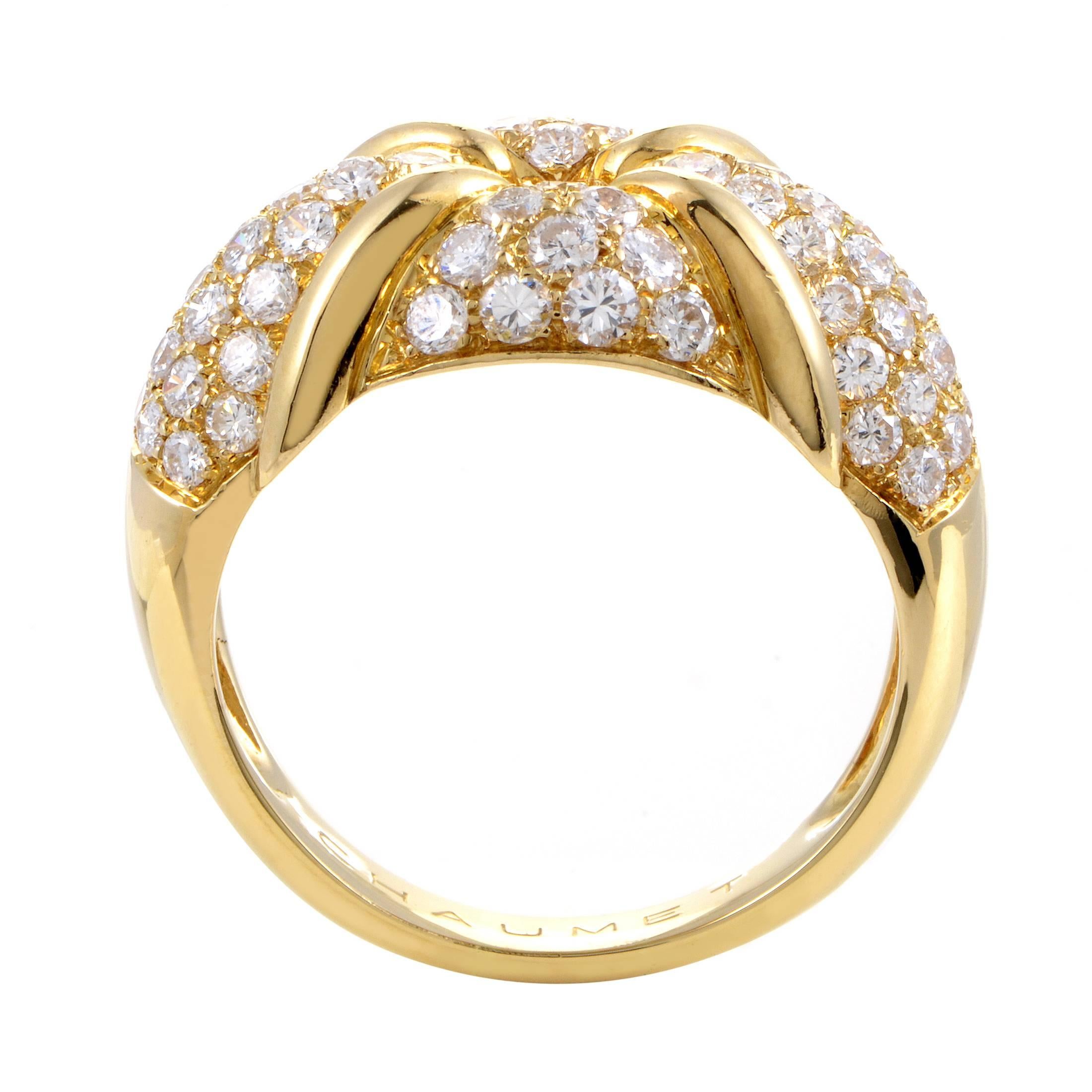 A sight of classic luxury and tasteful flamboyance, this enchanting ring from Chaumet boasts a wonderful shape crafted from precious 18K yellow gold and adorned with lustrous diamonds weighing in total approximately 1.90 carats.
Ring Size: 7.75 (55