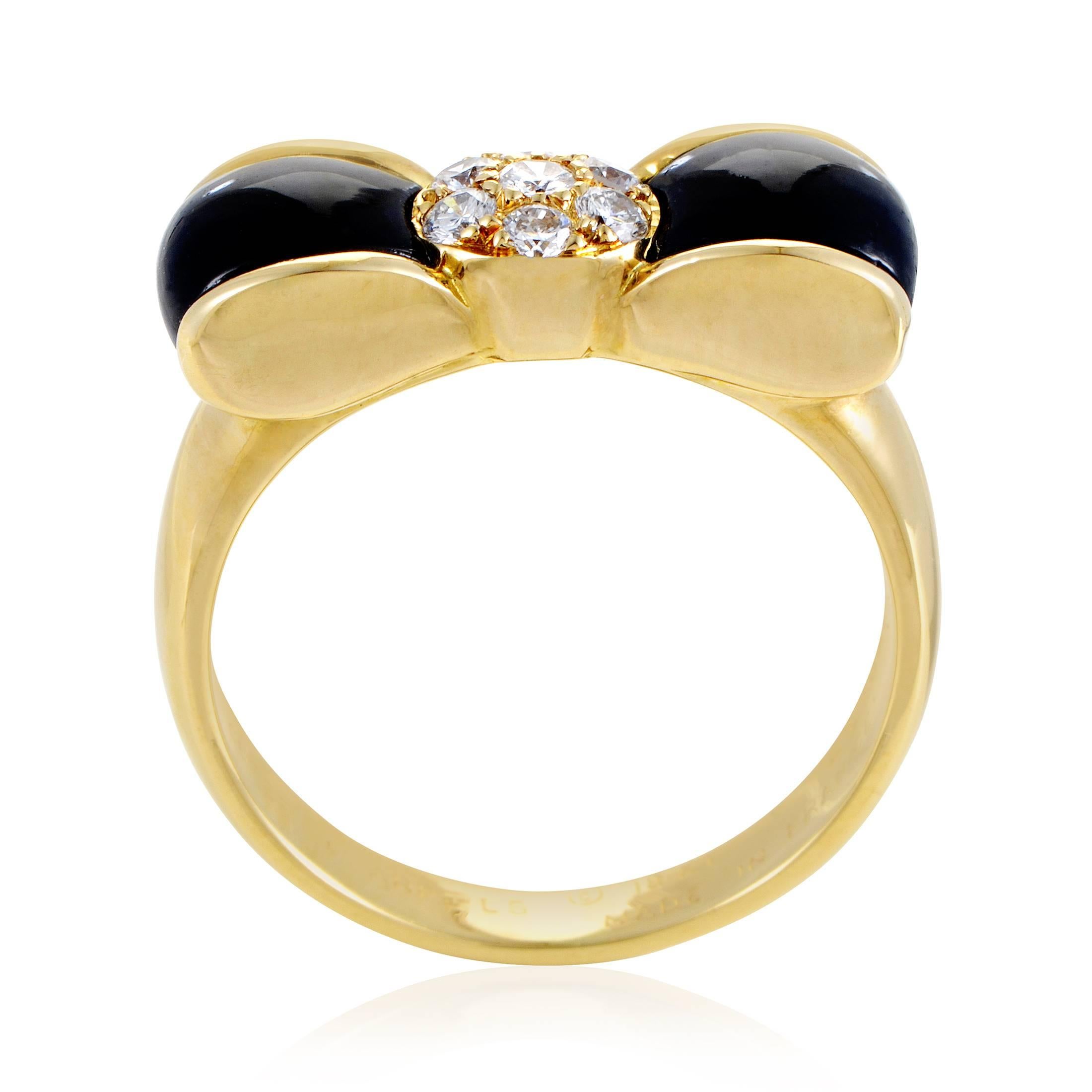 The wonderful shape of a bow tie is graced with eye-catching contrast in this remarkable ring from Van Cleef & Arpels made of immaculate 18K yellow gold and embellished with resplendent diamonds amounting to 0.12ct as well as stunning onyx stone for