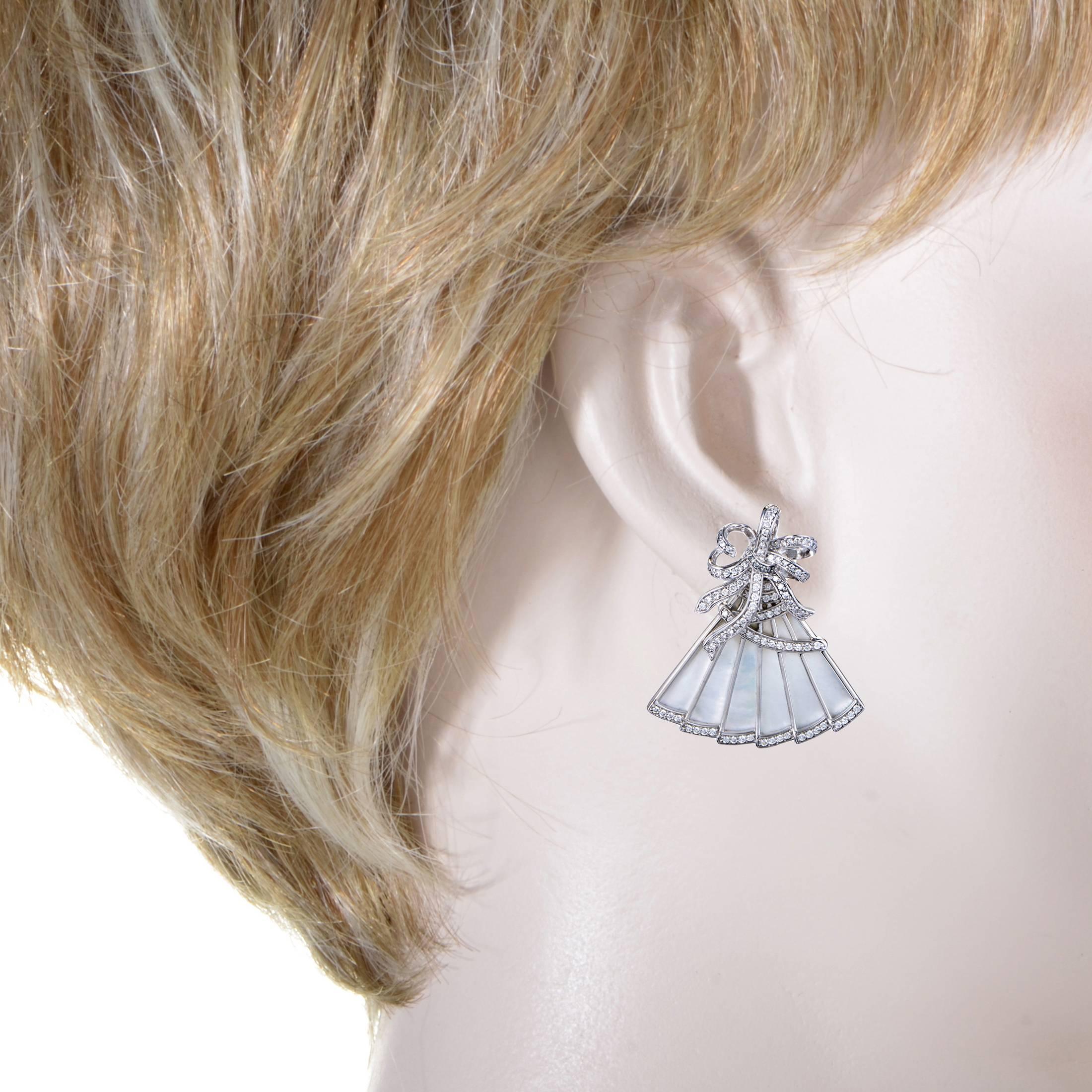 With angelic mother of pearl and 2.50 carats of glistening diamonds harmoniously complementing the splendid tone of 18K white gold, these majestic earrings from Ivanka Trump boast the alluring shape of hand fans, offering an enchanting and