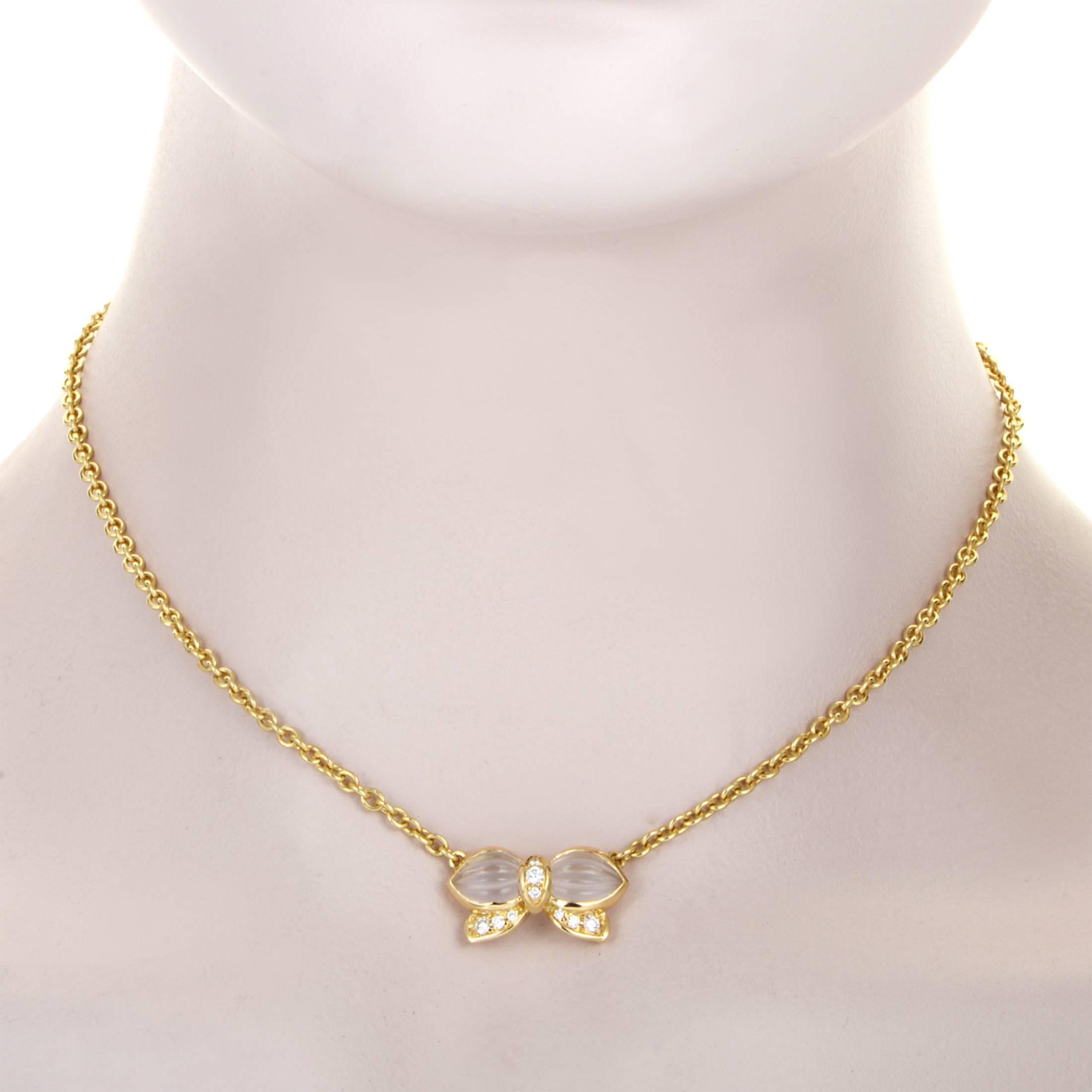 The marvelous shape of a bow is made of radiant 18K yellow gold and embellished with glistening diamonds weighing in total 0.25ct as well as two splendid crystals in this stylish and delightful necklace from Boucheron.
Pendant Dimensions: 0.88 x