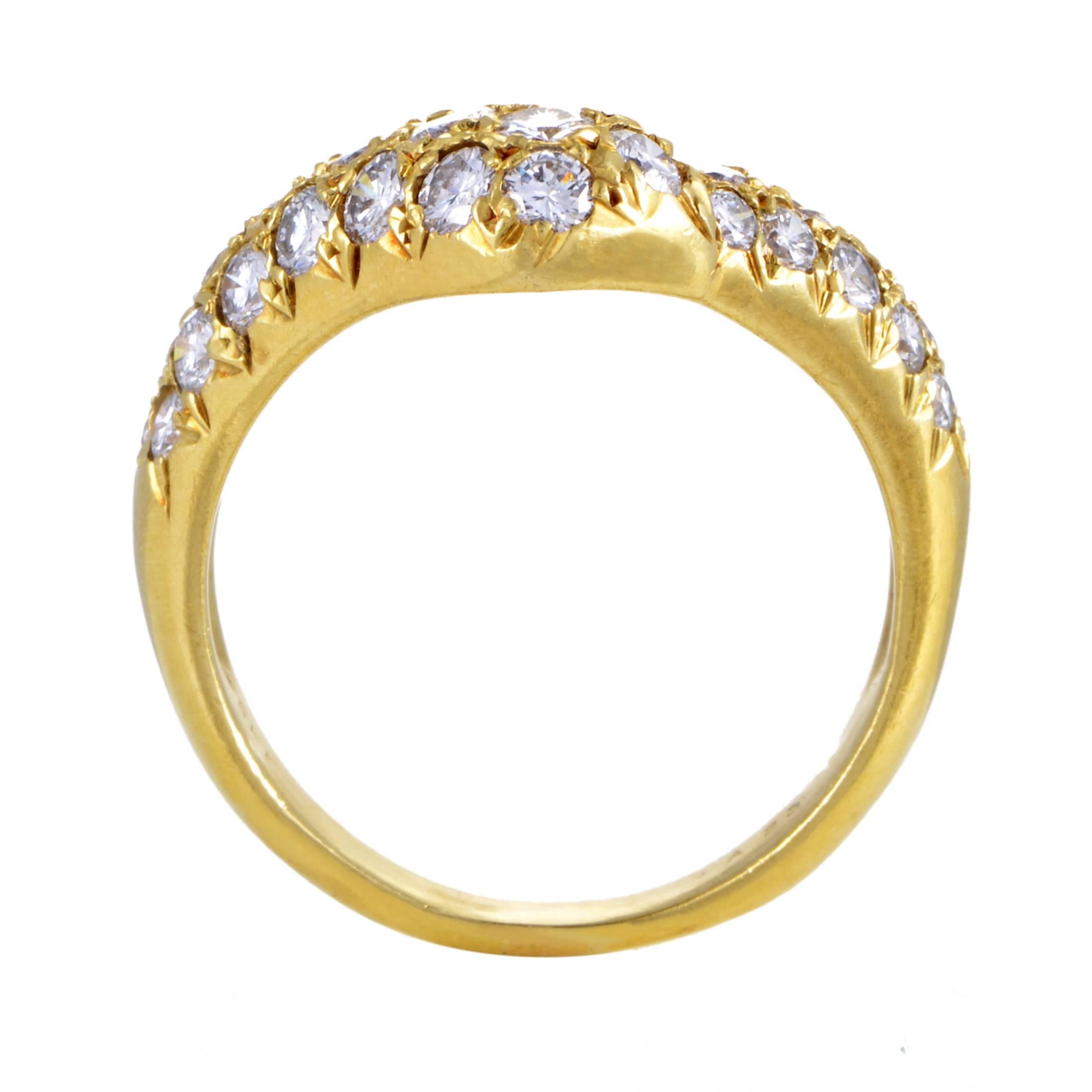 Boasting a wonderfully crooked shape made of enchantingly radiant 18K yellow gold and embellished with a neat arrangement of scintillating F-color diamonds of VVS clarity that weigh in total approximately 1.20 carats, this is a classically appealing