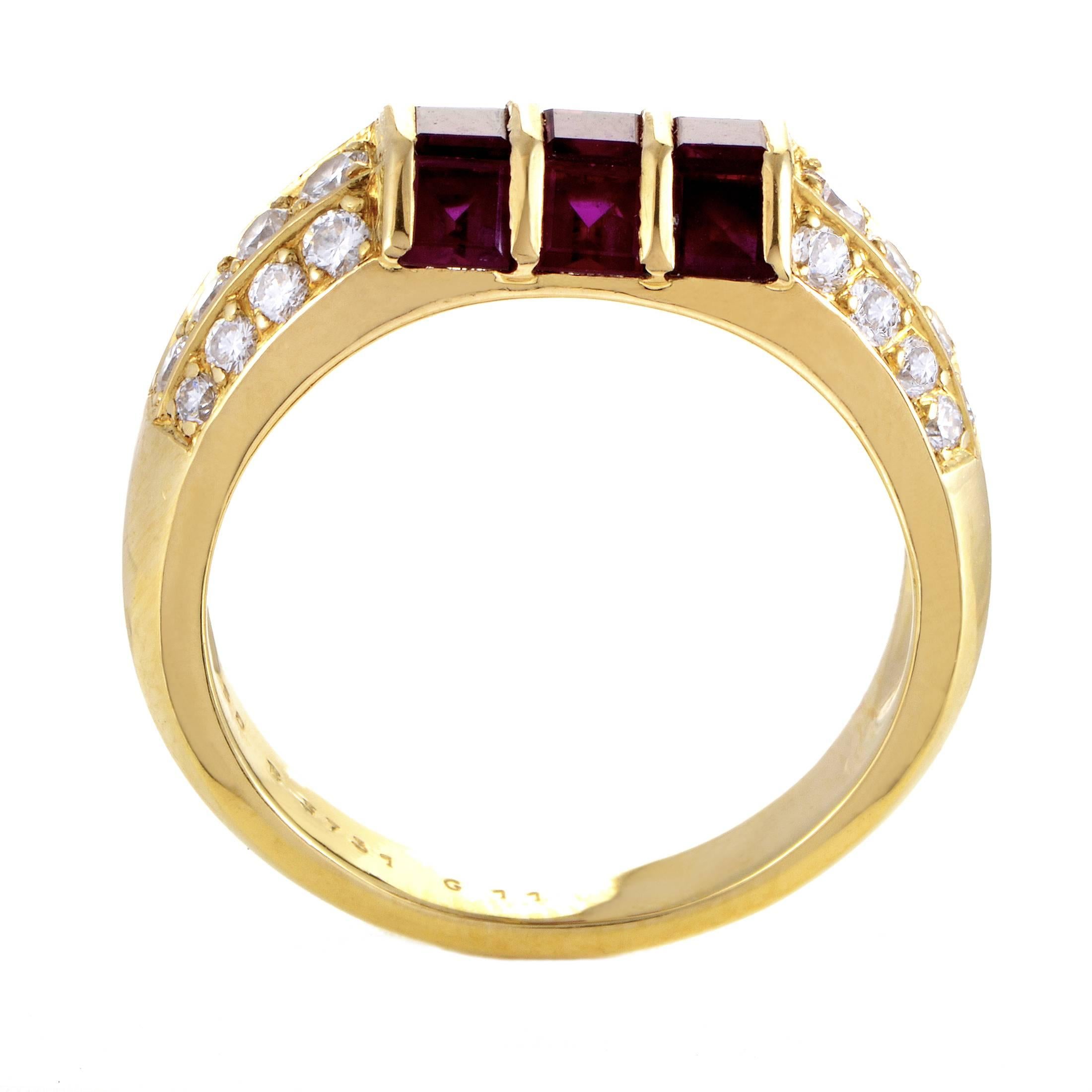 Leading up to the heart of the design where three gorgeous rubies totaling 1.10 carats are neatly set upon 18K yellow gold, the F-color diamonds of VVS clarity weighing in total 0.65ct add their charming luster to this nifty ring from Van Cleef &