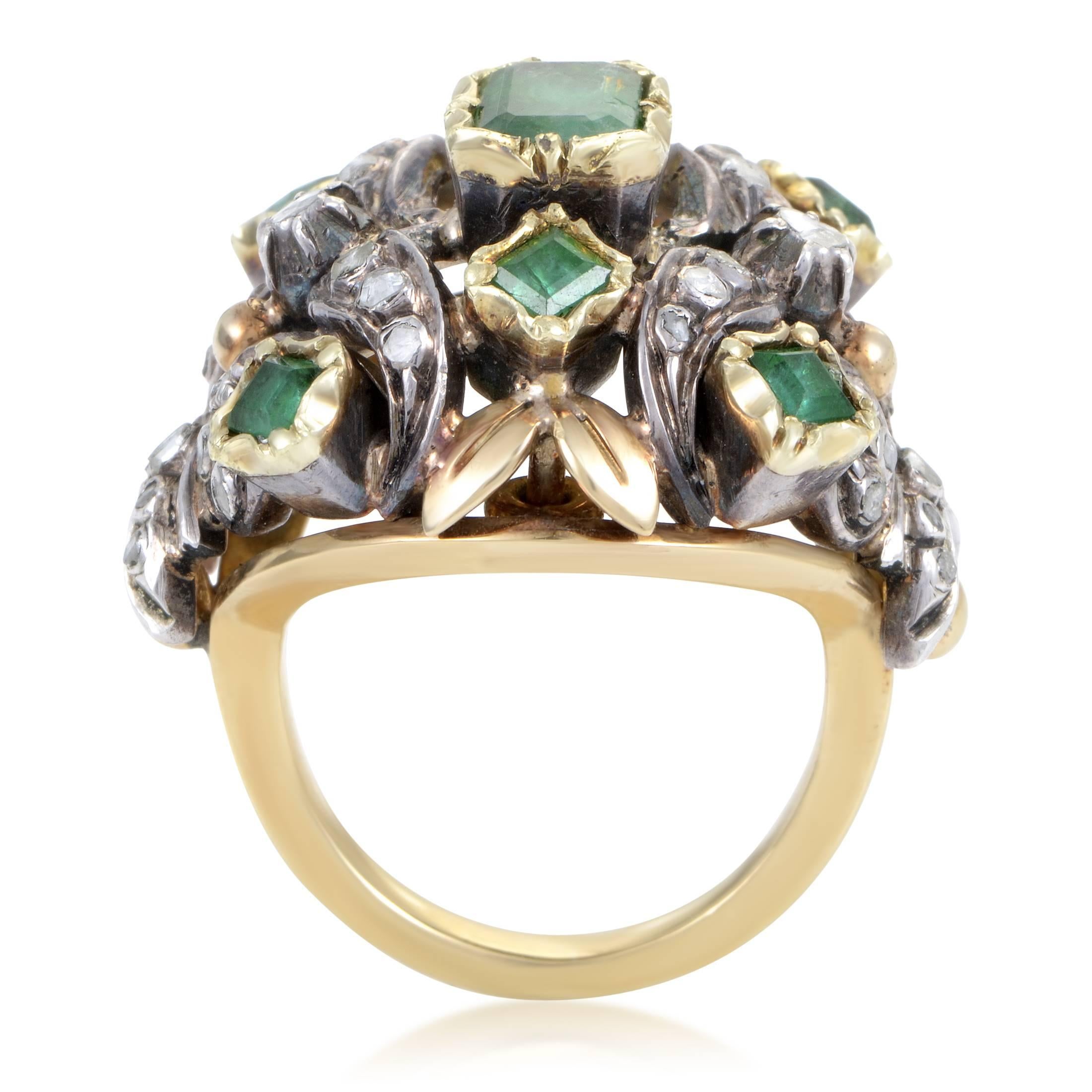 Scattered in a seemingly chaotic manner across the compelling décor created by marvelous interplay of radiant 18K yellow gold and shimmering silver, the fantastic emeralds weighing in total 3.00 carats and glittering diamonds totaling 0.85ct
