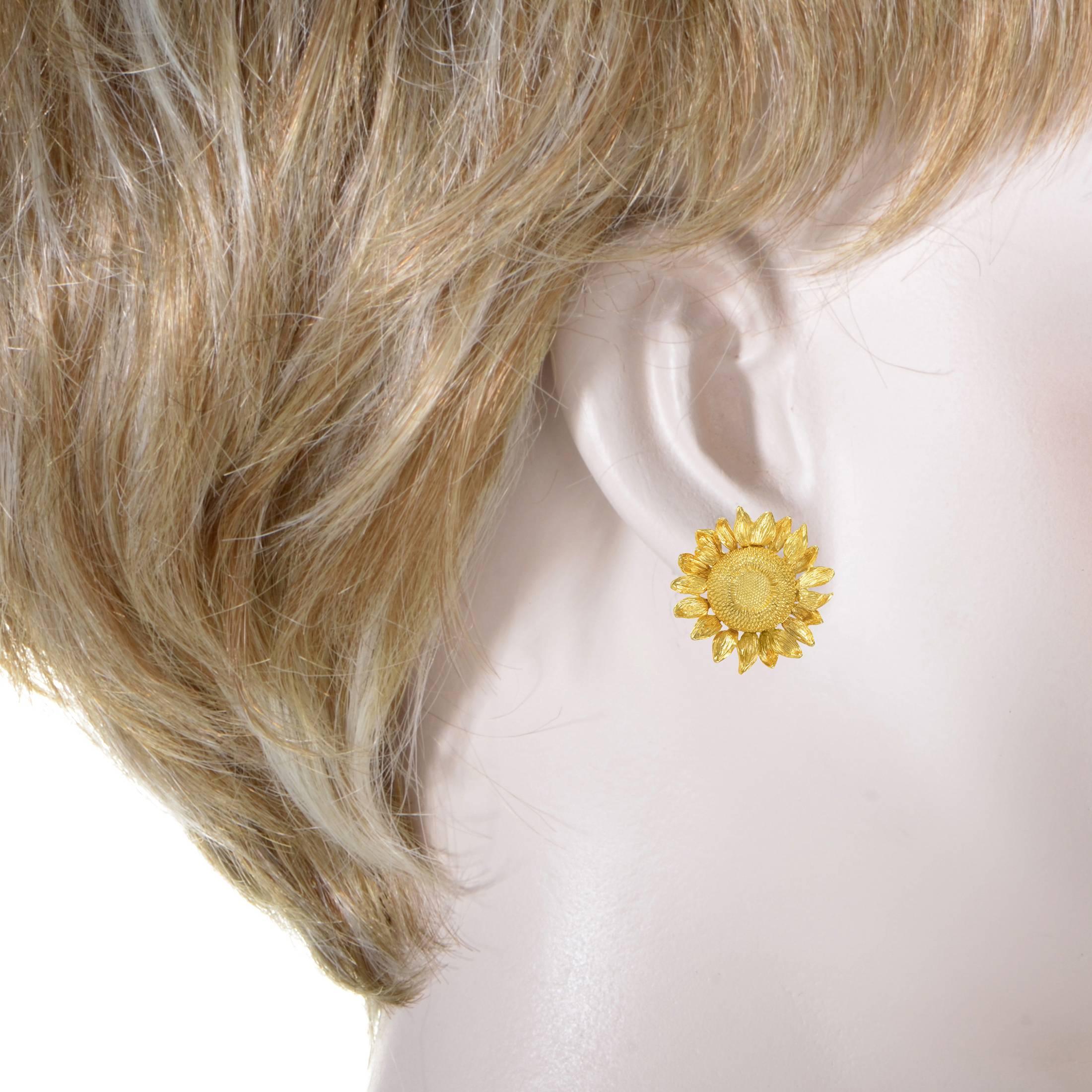 Evoking the exuberant radiance of the sun in a gorgeous sunflower motif, these fascinating earrings from Asprey are made of precious 18K yellow gold molded into an astonishing form and intricately ornamented to produce an irresistible