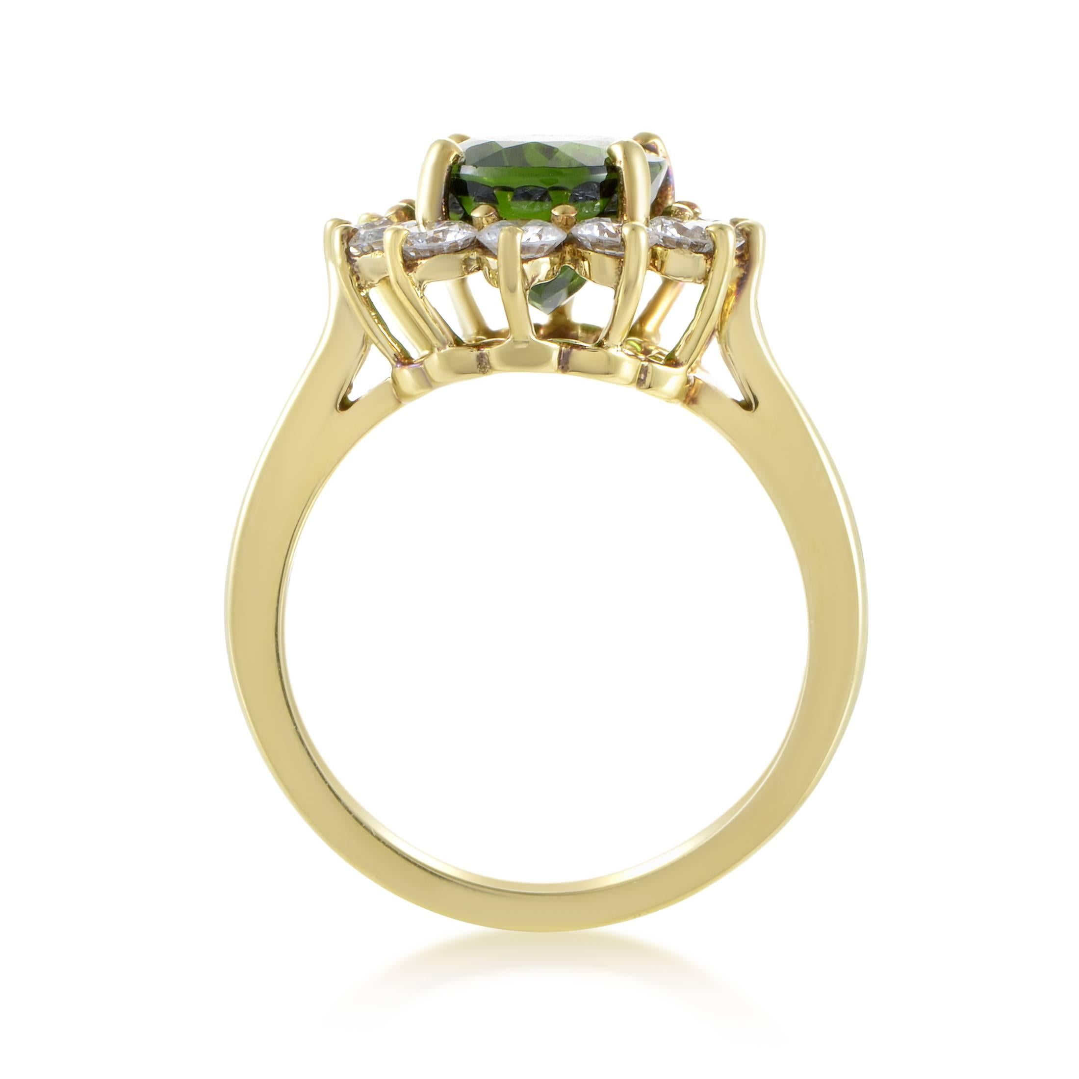 Providing a wonderful backdrop for the majestic beauty and exquisite cut of the remarkable green tourmaline weighing 3.00 carats, the neat arrangement of glittering diamonds amounting to 0.75ct adds a stunning final touch to this 18K yellow gold
