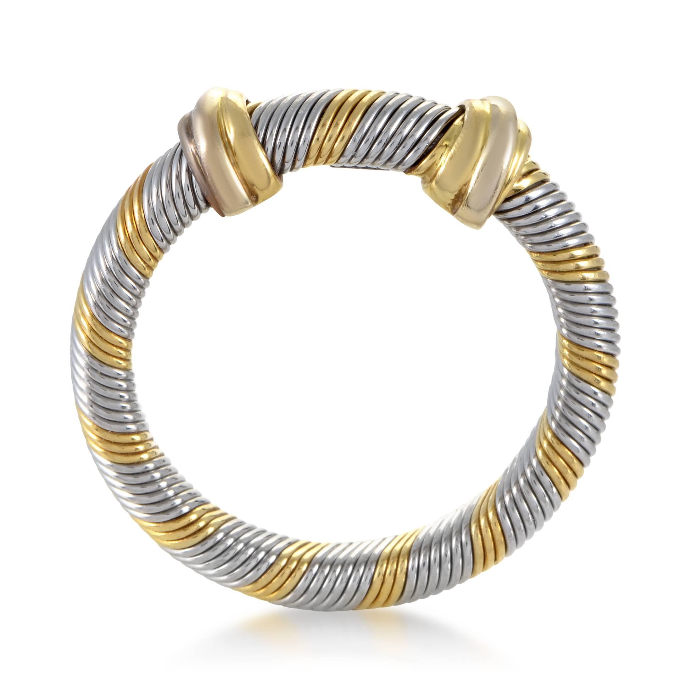 The magnificent coiled texture produces scintillating allure and fascinating play of light upon the impeccably polished surface of both the prestigious 18K yellow gold and shimmering stainless steel in this sublime ring from Cartier.
Ring Size:
