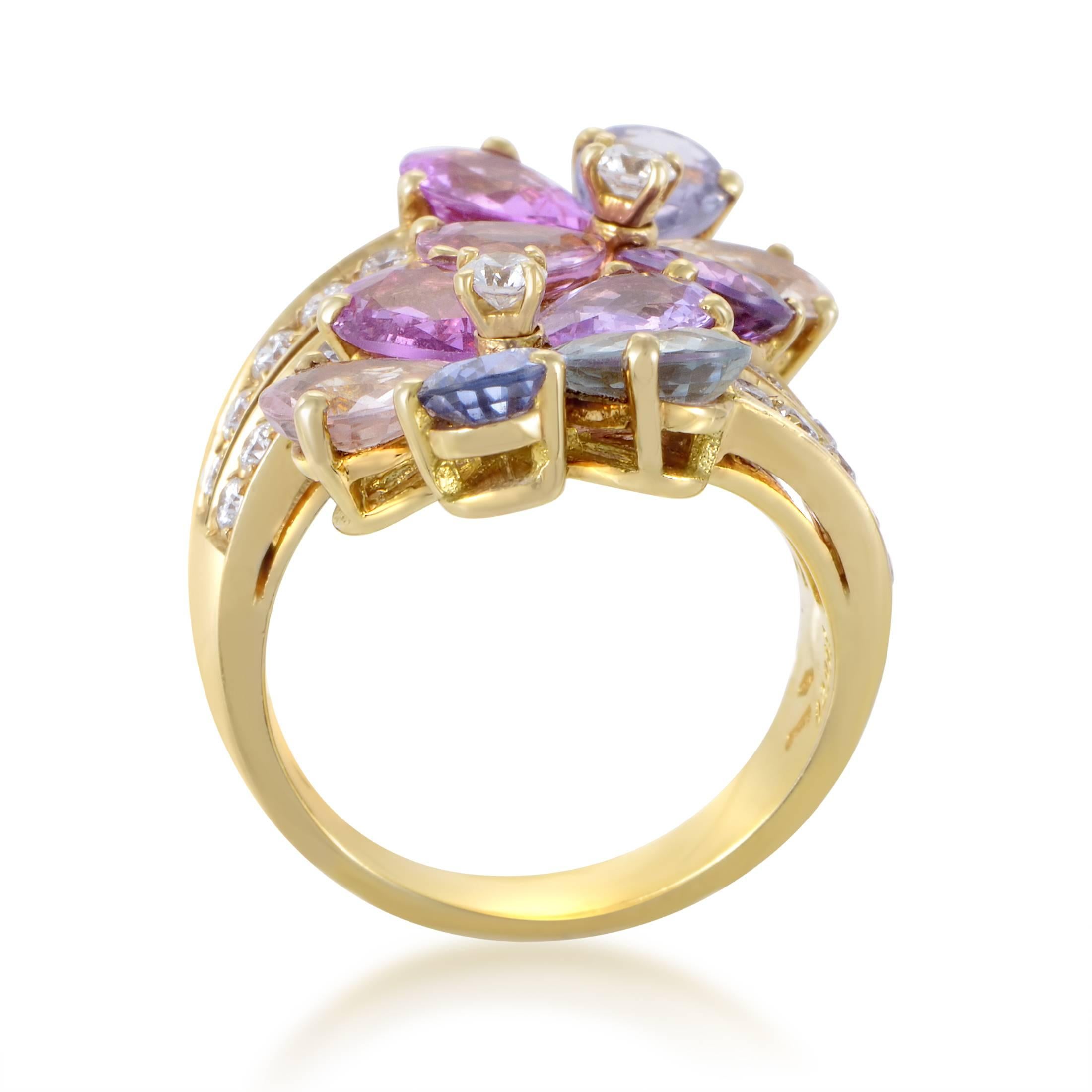 A truly extraordinary and spellbinding design sees vivacious multicolored sapphires weighing in total approximately 8.00 carats complemented by lustrous diamonds amounting to 0.75ct in this eye-catching and memorable 18K yellow gold ring from