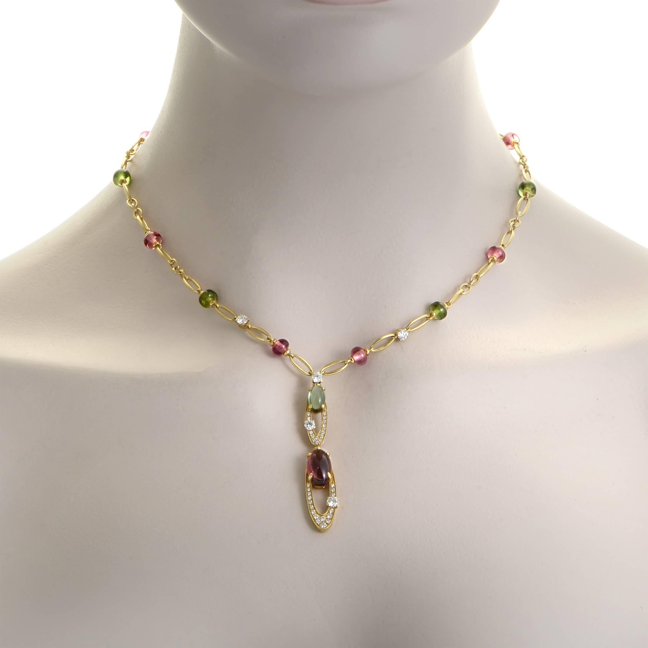 Wonderfully graceful and delightfully feminine, this stunning necklace from Bulgari is made of precious 18K yellow gold embellished with glistening diamonds weighing in total approximately 2.00 carats as well as nifty pink and green