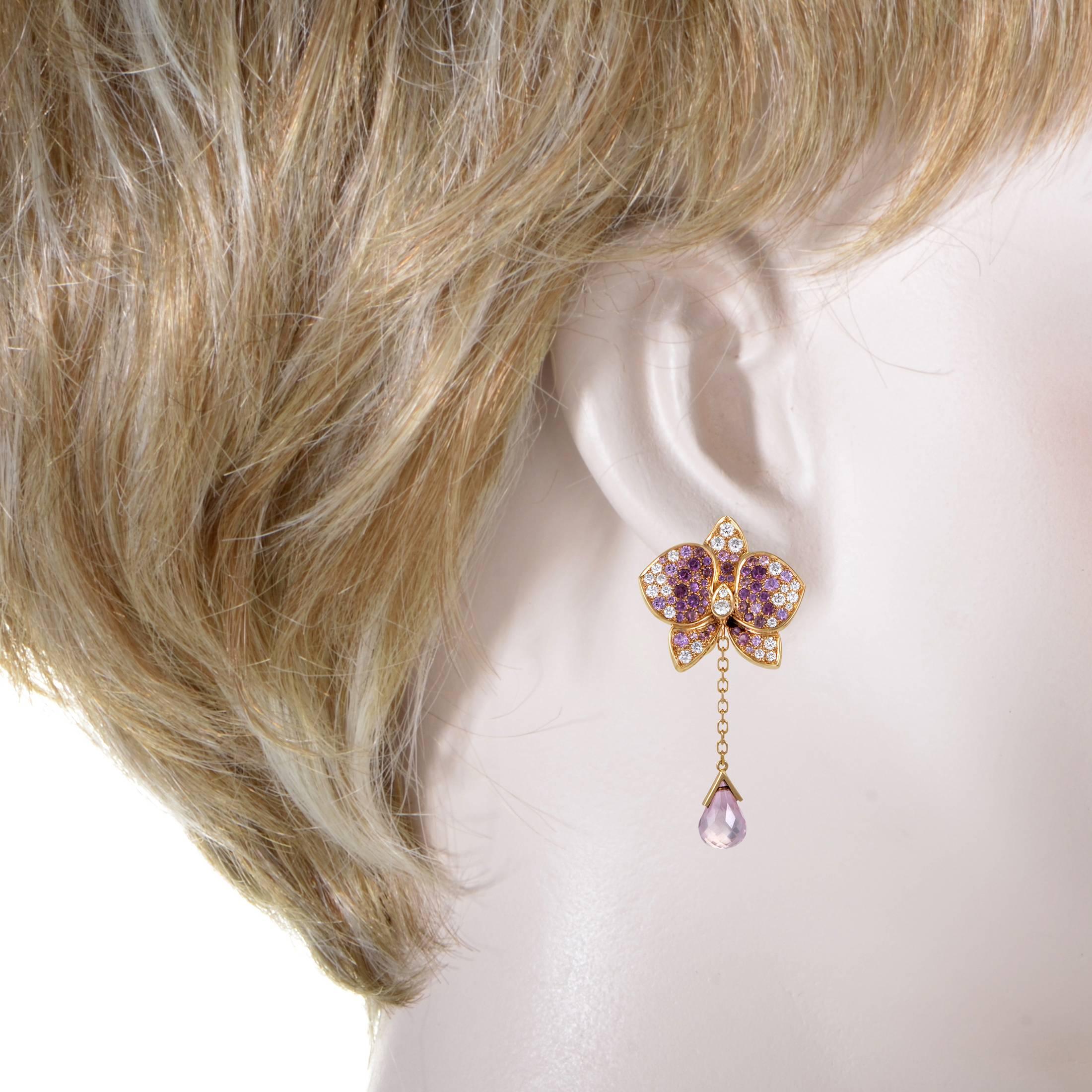 Tender blooms are the hallmark of Cartier's Caresse d'Orchidées collection. This authentic pair of earrings from the collection are made of 18K rose gold and are set with diamonds, pink sapphires, pink tourmaline, and rhodolite garnets. Lastly, a