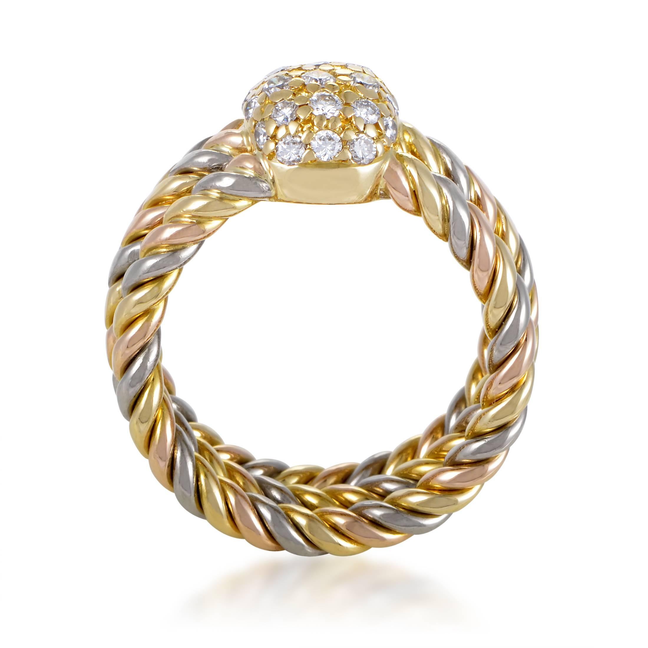 This ring from Cartier is a stunning combination of a precious stone and metals. Yellow, white and rose gold spin like rope to shape the 8mm wide band. Their united rotation peaks with a broad setting of 0.50ct diamond that reaches 6mm high and