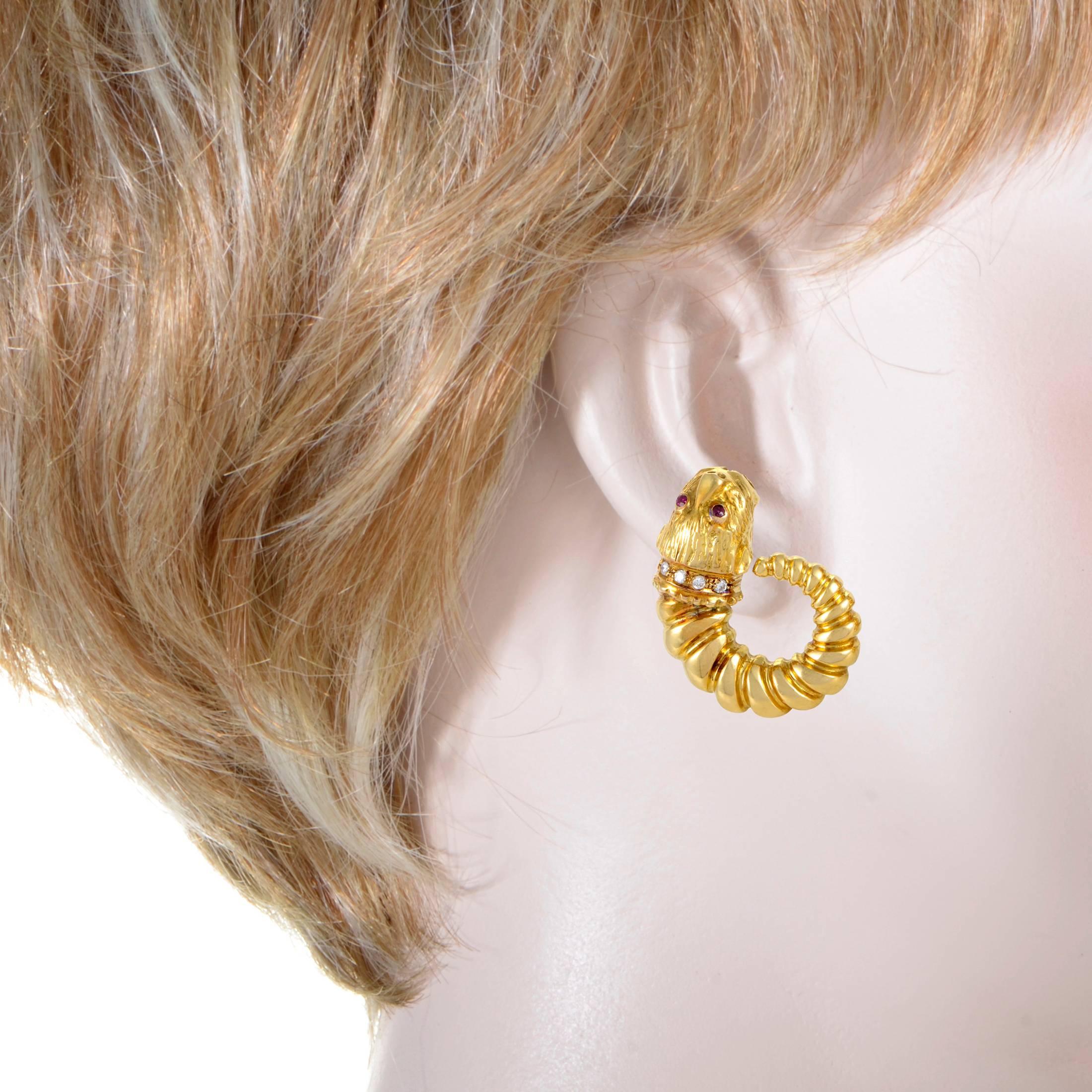 This expertly crafted pair of clip-on earrings from Ilias Lalaounis boast a unique appeal that could only come from the Greek jeweler. The earrings are made of 18K yellow gold and boast lion motifs set with .20ct of white diamonds and regal red
